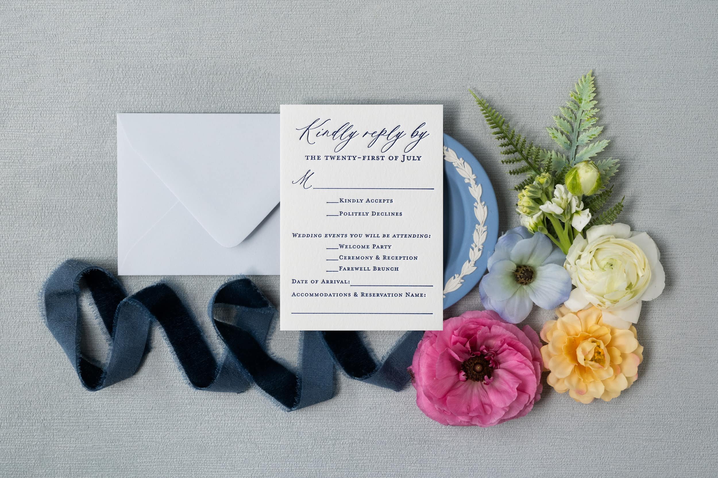 Comprehensive luxury wedding paper story showcasing engagement party invitations, save the dates, wedding invitations, and day-of details with letterpress, blind debossing, edge painting, and custom crest design.