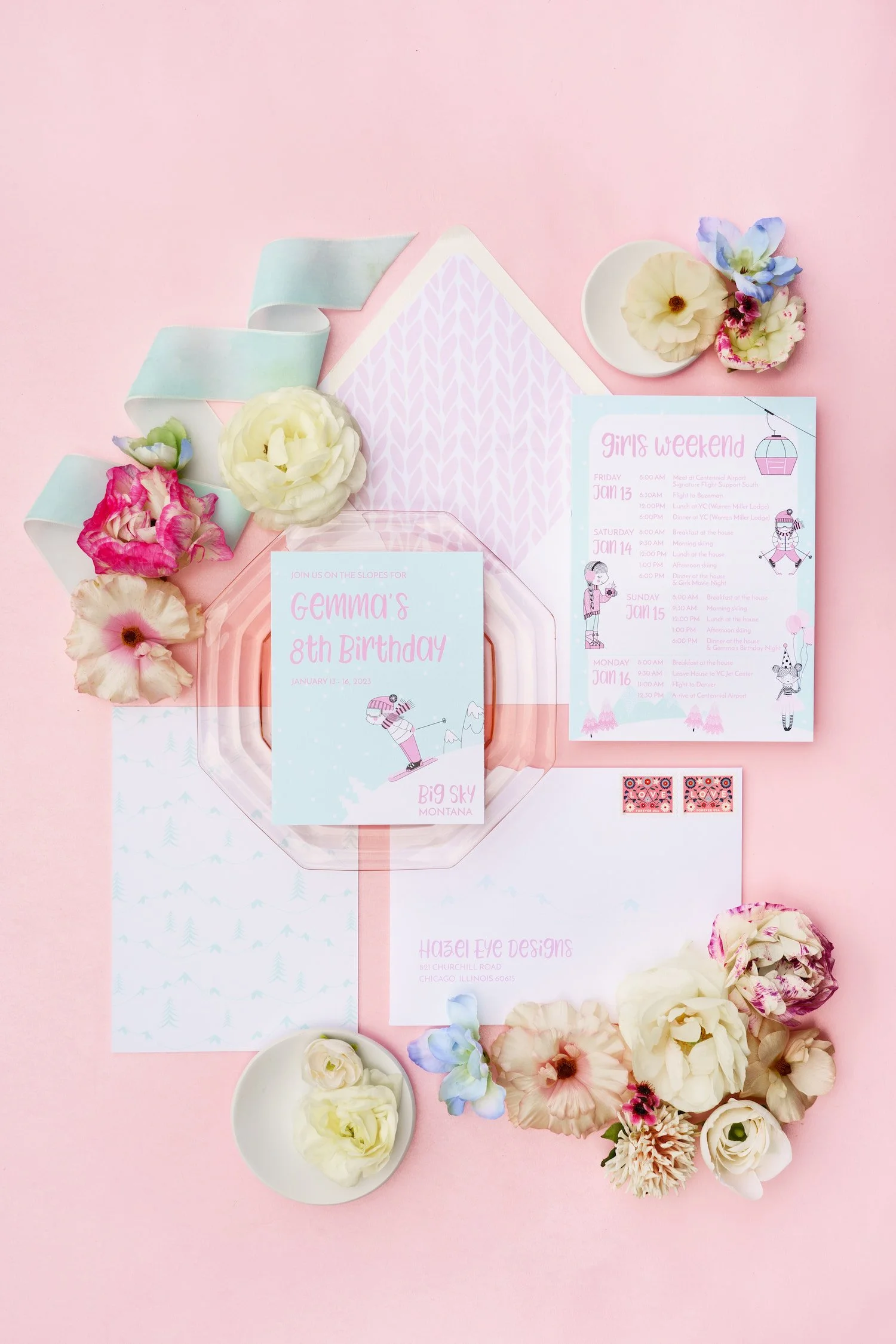 Luxury ski-themed birthday invitation suite for an eight-year-old girl featuring pink and aqua details, fluffy tulle ribbon, ski motifs, cable-knit envelope liners, and alpine-inspired postage.