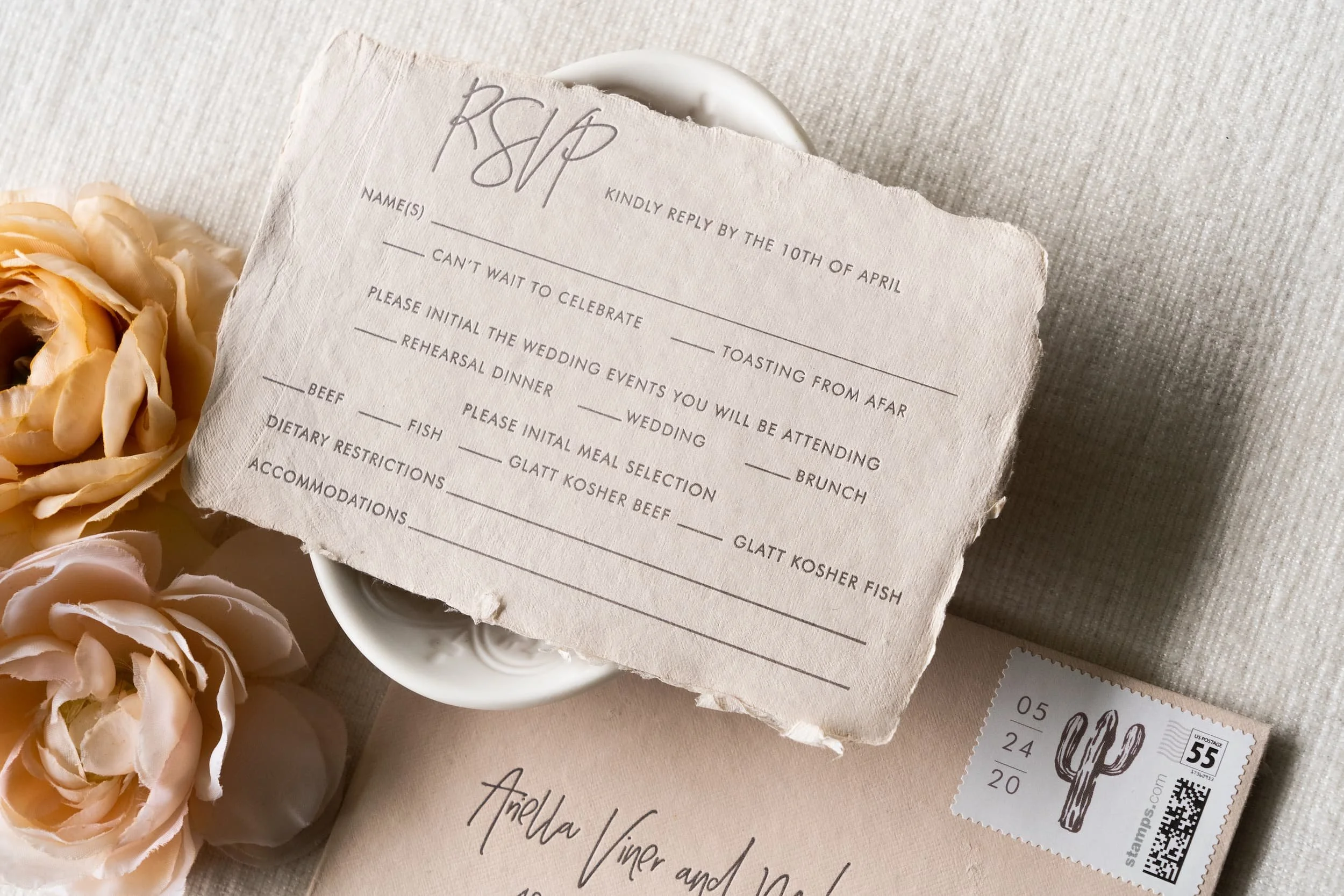 Elegant Scottsdale wedding invitation suite with reply card featuring handmade paper, letterpress printing, and refined desert-inspired details for a luxury Four Seasons wedding.