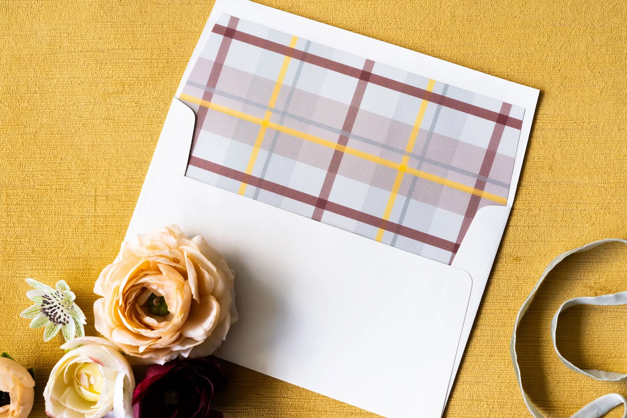 Luxury letterpress and foil wedding invitation suite with plaid liner for a September wedding at Kimpton Hotel Born featuring gray, harvest gold, burgundy, and black-and-white details inspired by the city of Denver.