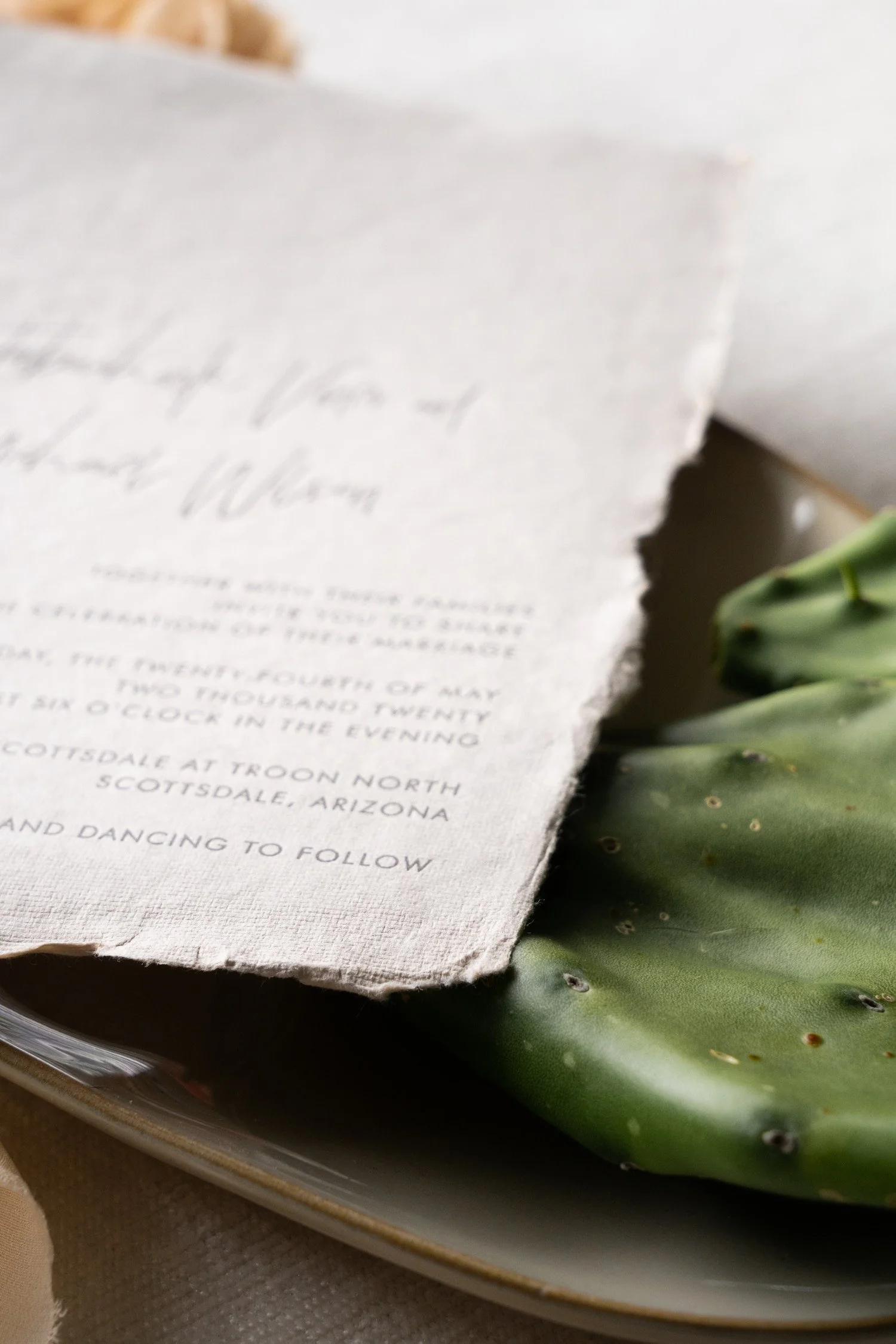 Elegant Scottsdale wedding invitation suite featuring handmade paper, letterpress printing, and refined desert-inspired details for a luxury Four Seasons wedding.