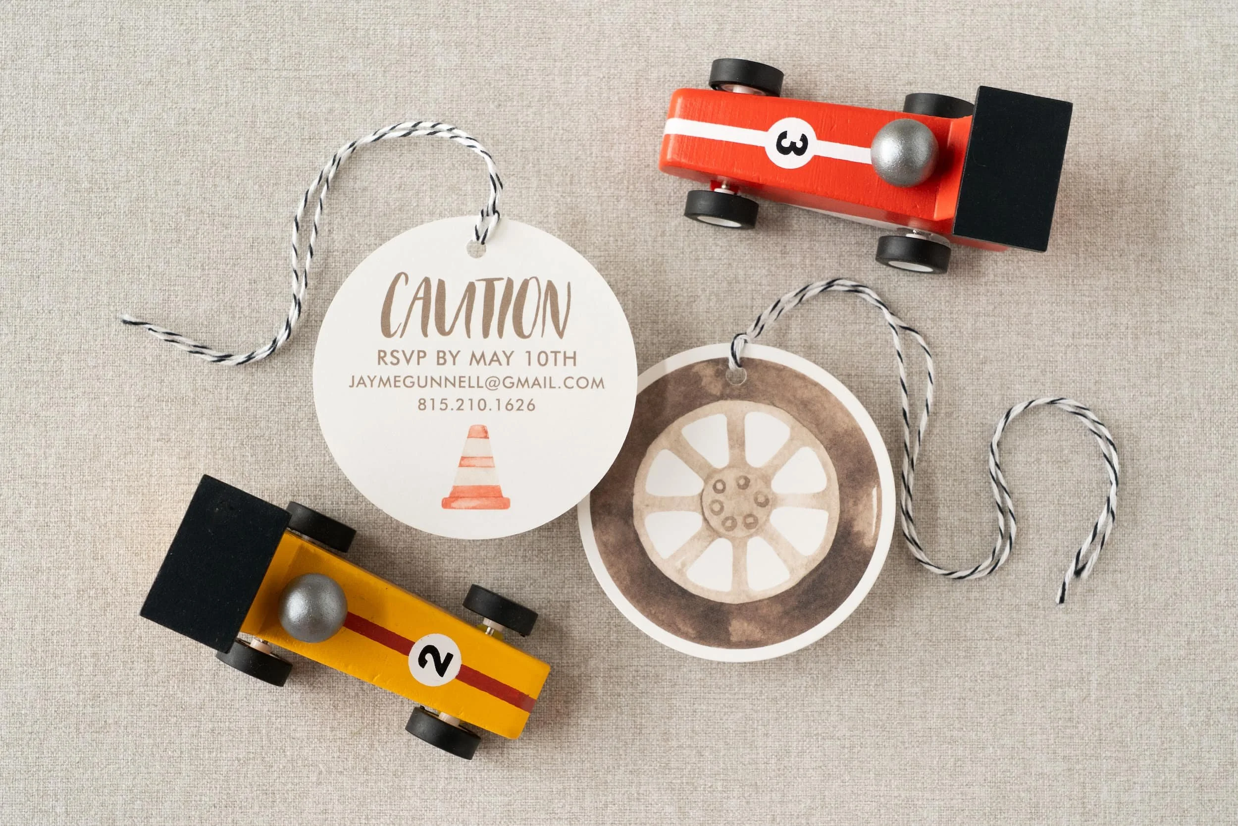 Race car-themed second birthday stationery suite with playful watercolor cars, checkered flag patterns, and motorsport-inspired paper details.