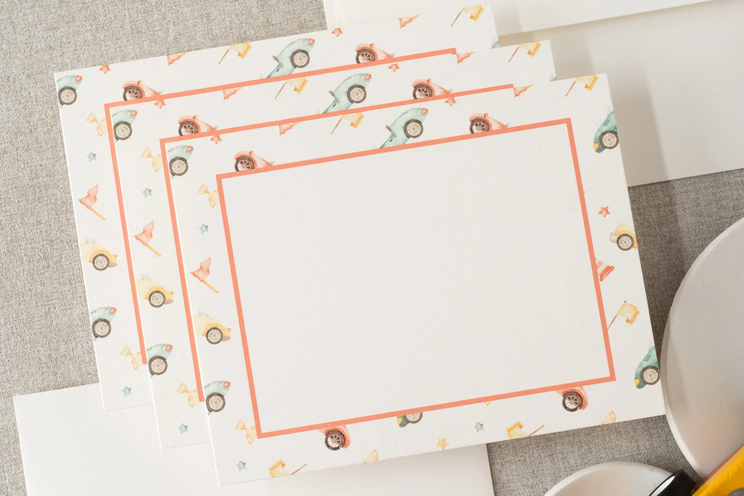 Race car-themed second birthday stationery suite with playful watercolor cars, checkered flag patterns, and motorsport-inspired paper details.