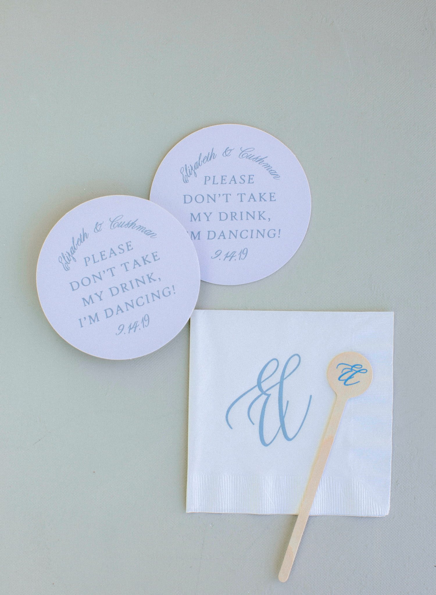 Coordinated wedding day stationery including ceremony programs, acrylic seating chart, signature cocktail signs, menus, place cards, and table numbers for an elegant fall wedding in Steamboat Springs.