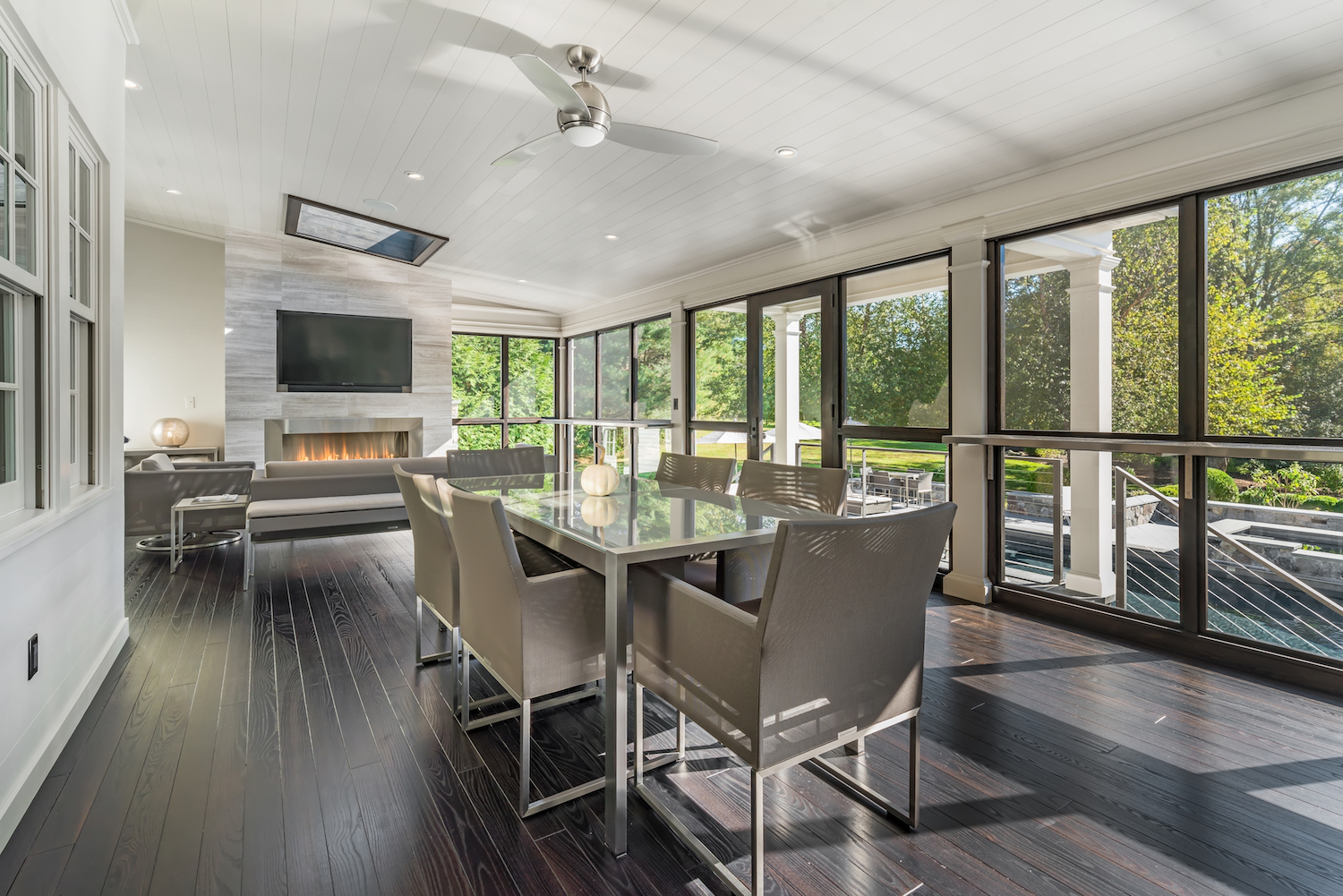 Enclosed Porch with Seating, Dining Area, and Fireplace