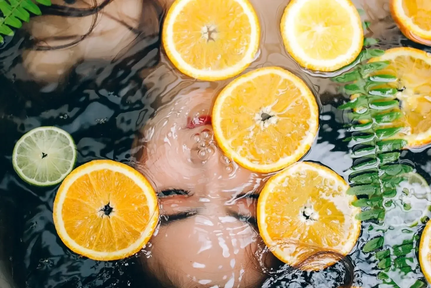 A Picture of relaxing under the water and oranges and limes , Kindman & Co, LMFT Therapist