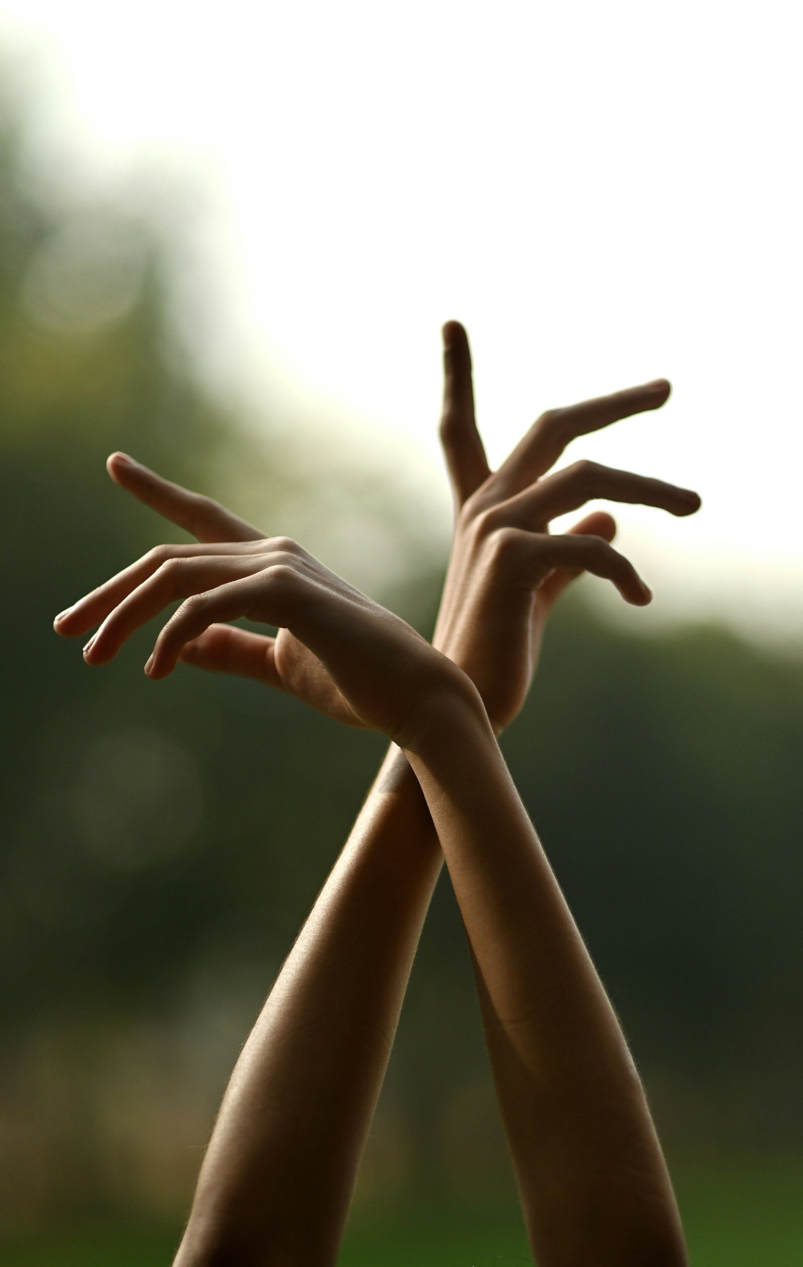 two hands dancing and turned away from each other representing change and life transitions