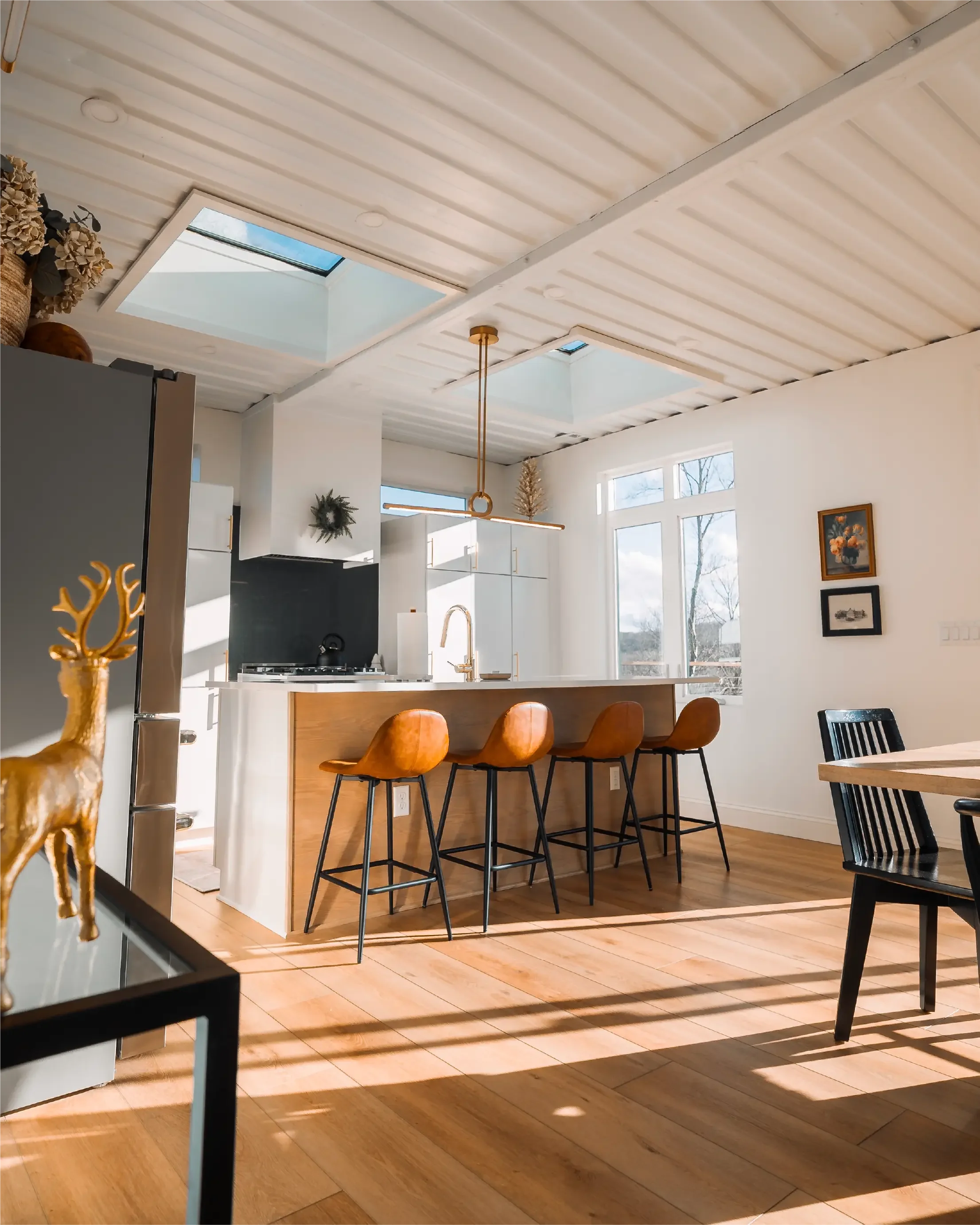 Bright second-floor kitchen with island seating and skylights in The Overlook Hocking Hills cabin