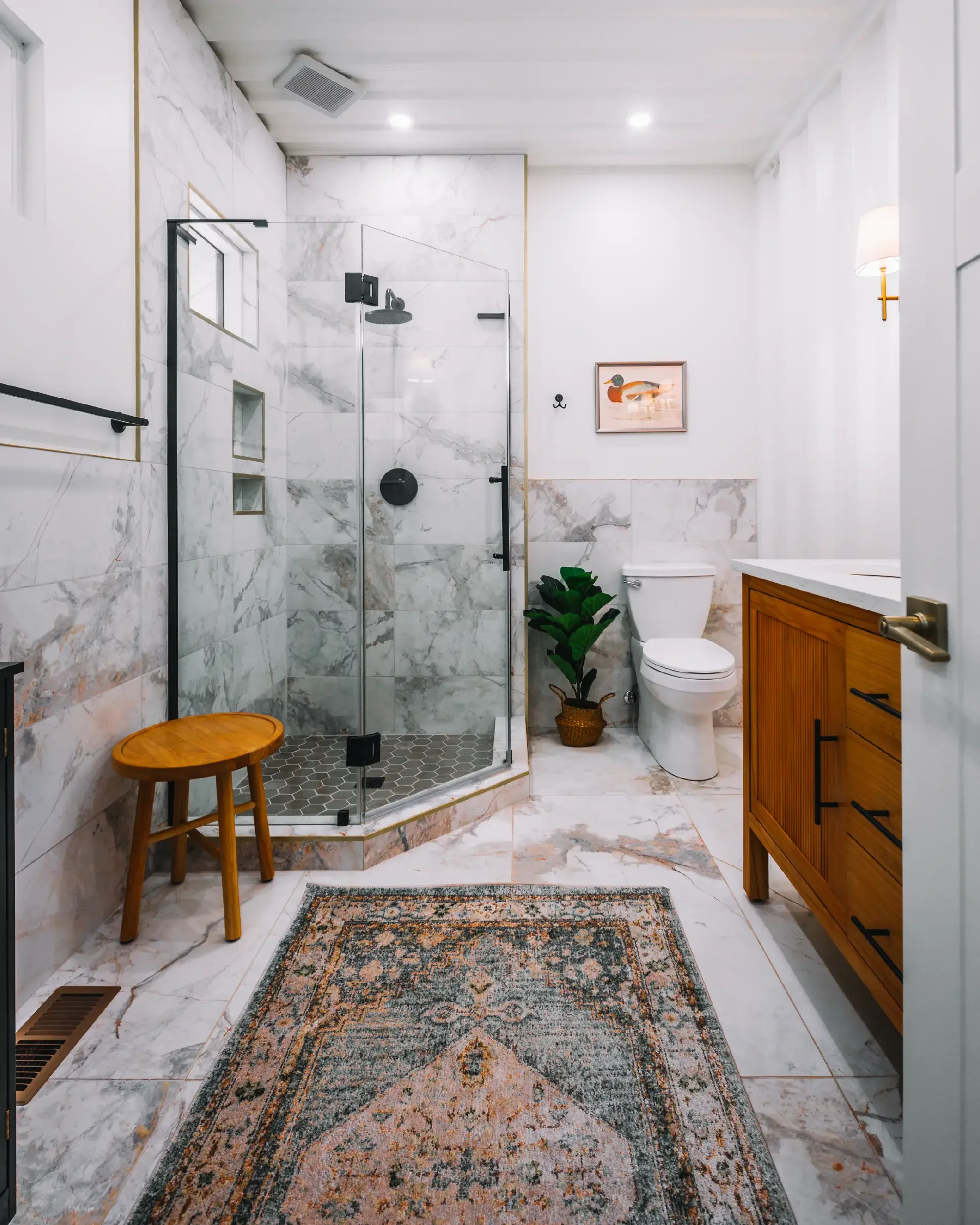 Marble-tiled full bathroom with a glass walk-in shower in The Overlook Hocking Hills cabin