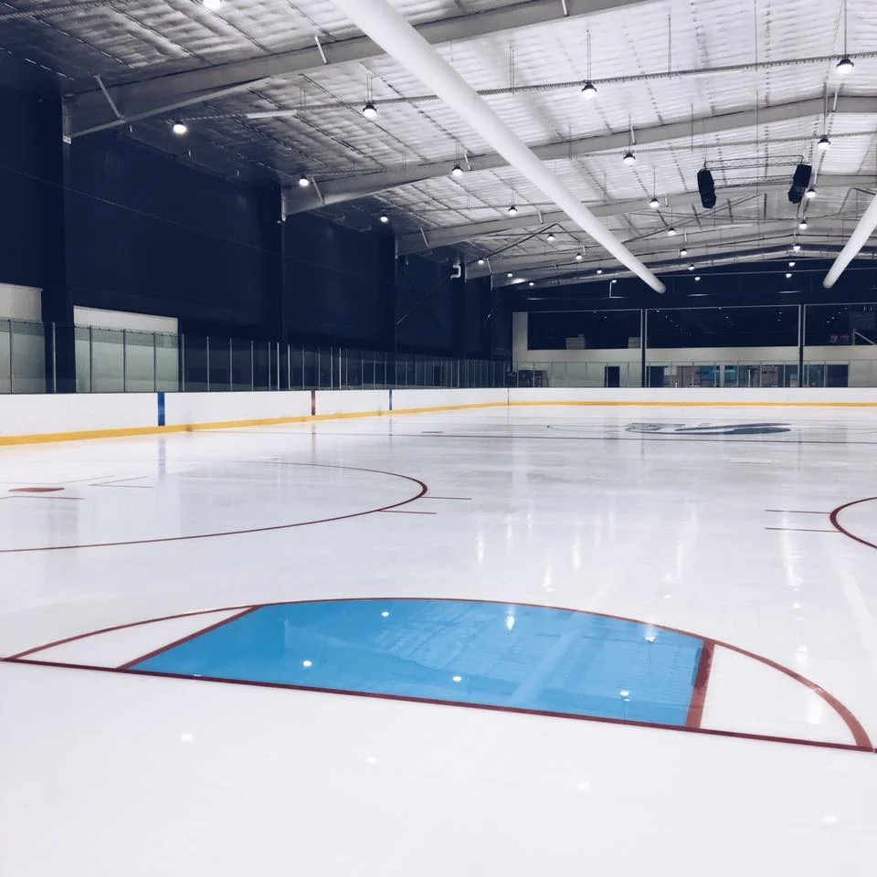 view of iceHQ ice hockey rink from behind the goal crease