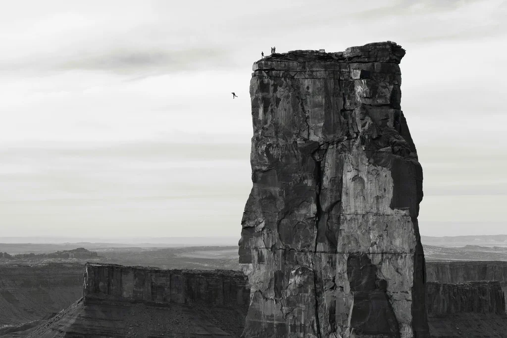 Krystle Wright, Freefall Michael Tomchek leaps off Castleton Tower 400ft as fellow BASE jumpers look on Castle Valley Utah, 2014