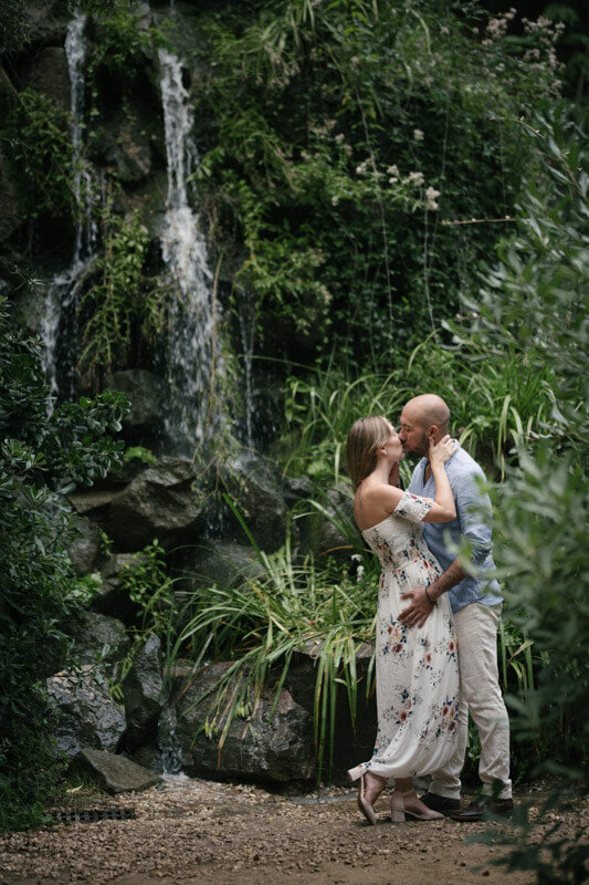 Beautiful couple waterfall Labyrinth Park of Horta in Barcelona