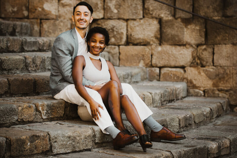 International stylish couple sitting Gothic quarter