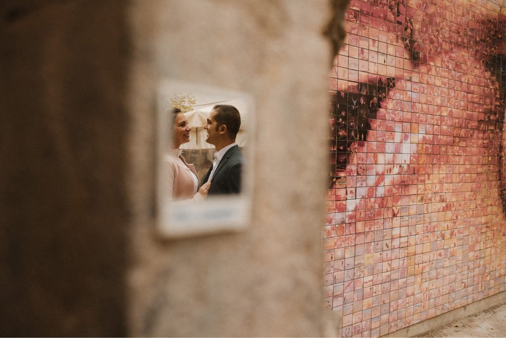 Reflection of couple at famous kiss photo side Gothic Quarter