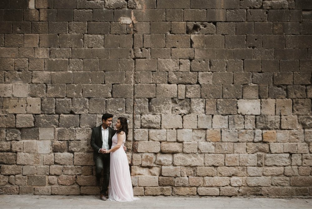 couple at gothic wall