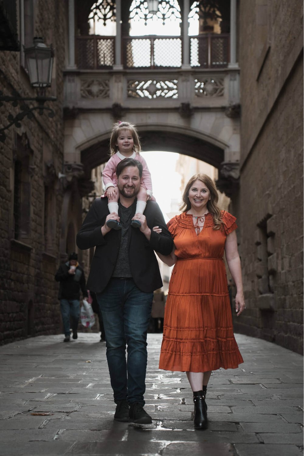 family at famous bridge in gothic quarter