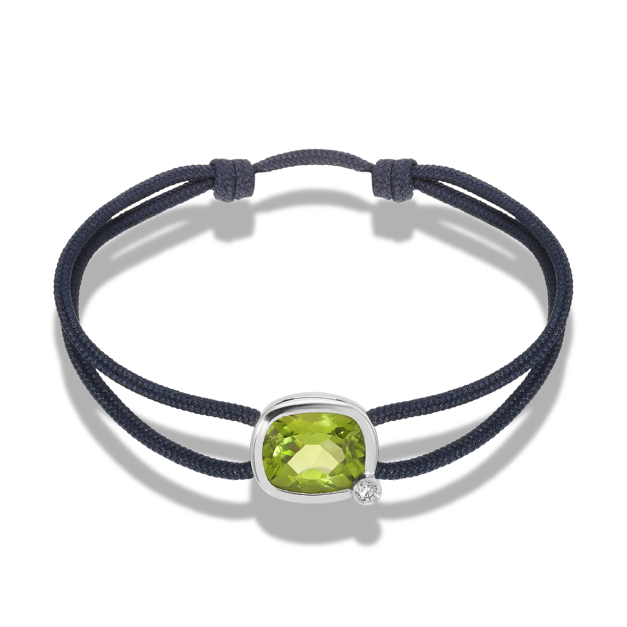  Peridot and Diamond set in 18K white gold on admiral blue cord. Handmade in Los Angeles. $5,100 