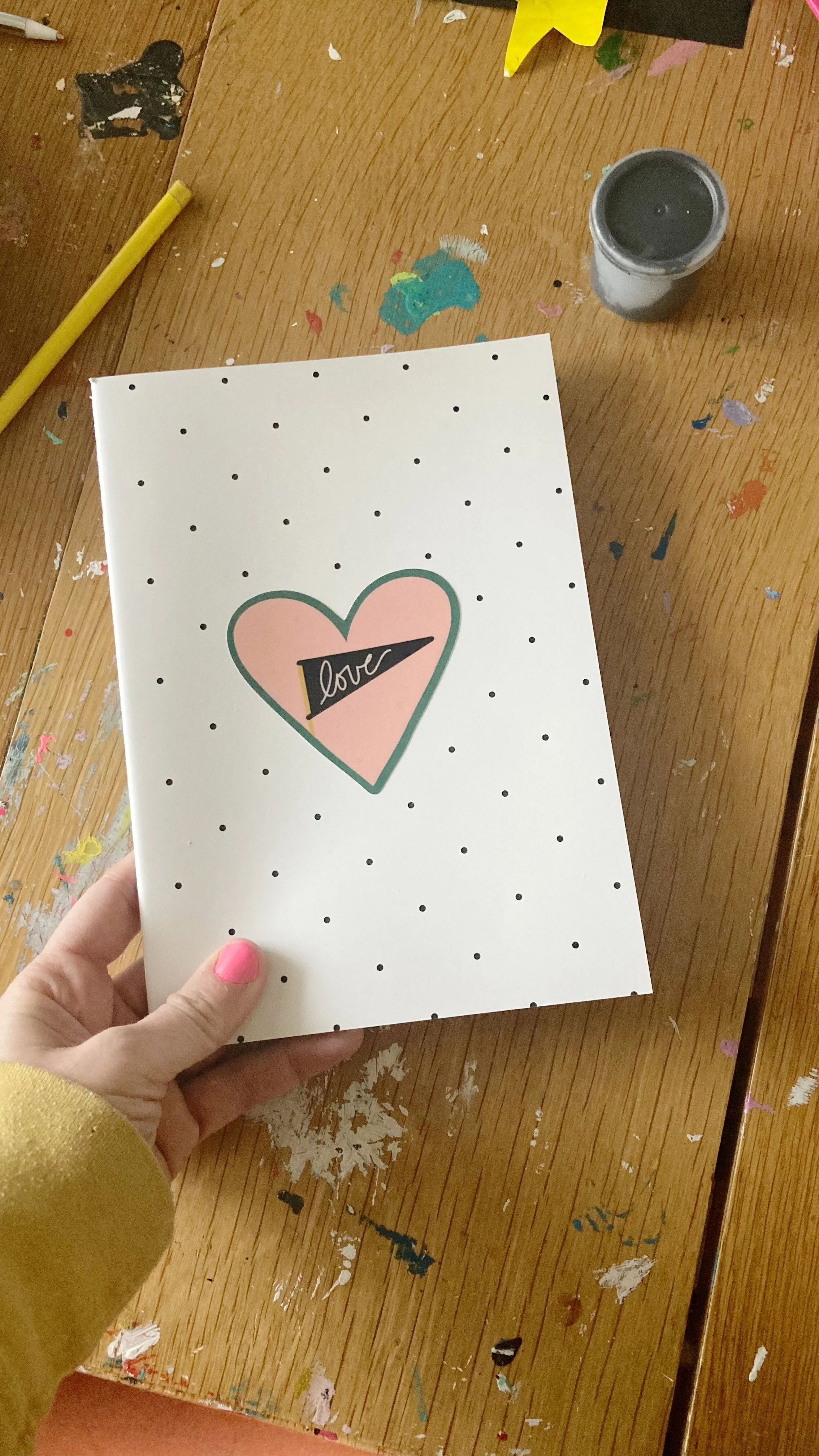 love flag vinyl decal on notebook - brooke petermann art