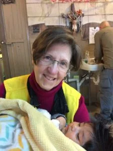 Volunteer Billie Greenwood cared for a very tiny migrant on the Northern Mexico border with the U.S. as one of her duties at the migrant assistance center.
