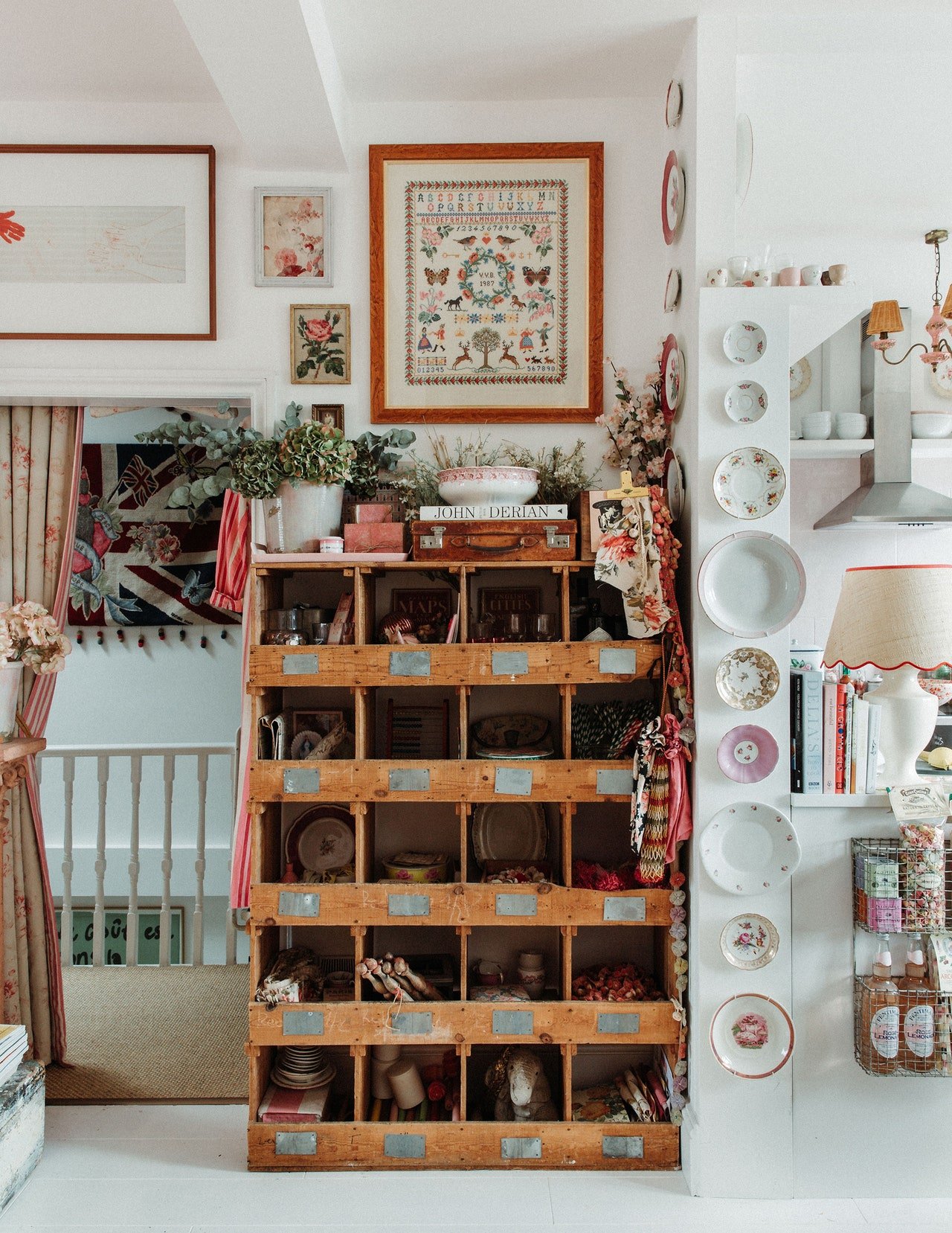    Maximalist, space, small space, doesn’t have to look messy, Designer, creative consultant,&nbsp;Violet Dent, pink, front room, stripes, flowers, petals, frames, gallery wall, big beautiful window, vintage dining table, framed art, lamp shades, kit