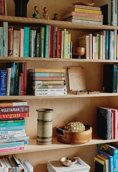   small homes, creative, space, apartment, creative space, tidy, spacious, limited space, open shelving, kitchen, organised, wooden cabinetry, storage, small space, artwork on the walls, artwork, shelves, plants, books, Natural materials, dining roo