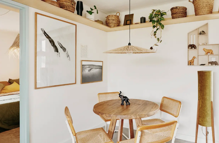   small homes, creative, space, apartment, creative space, tidy, spacious, limited space, open shelving, kitchen, organised, wooden cabinetry, storage, small space, artwork on the walls, artwork, shelves, plants, books, Natural materials, dining room