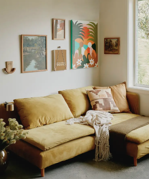   small homes, creative, space, apartment, creative space, tidy, spacious, limited space, open shelving, kitchen, organised, wooden cabinetry, storage, small space, artwork on the walls, artwork, shelves, plants, books, Natural materials, dining room