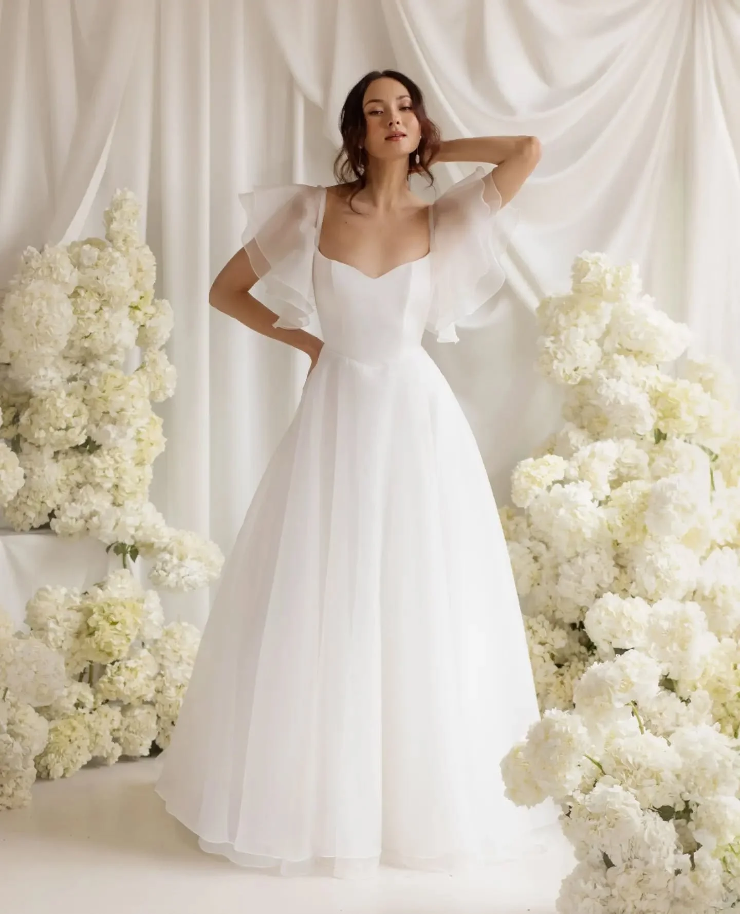 CINDY // The brand new @truvellebridal gown is a fresh take on the Lillie silhouette with a new soft sweetheart neckline, delicate cutouts and soft basque. The fuller sleeves are detachable and can be worn on the shoulder or off for a more romantic v