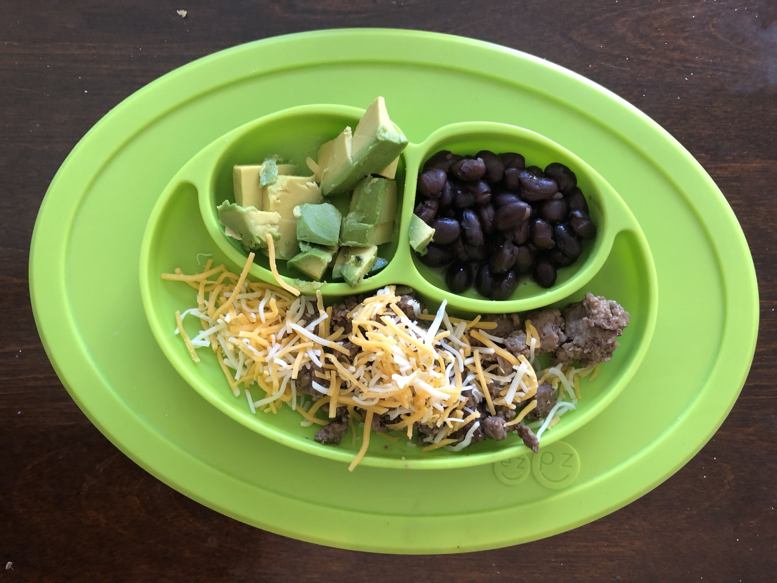 ground beef with sauteed spinach. cheese, avocado, black beans