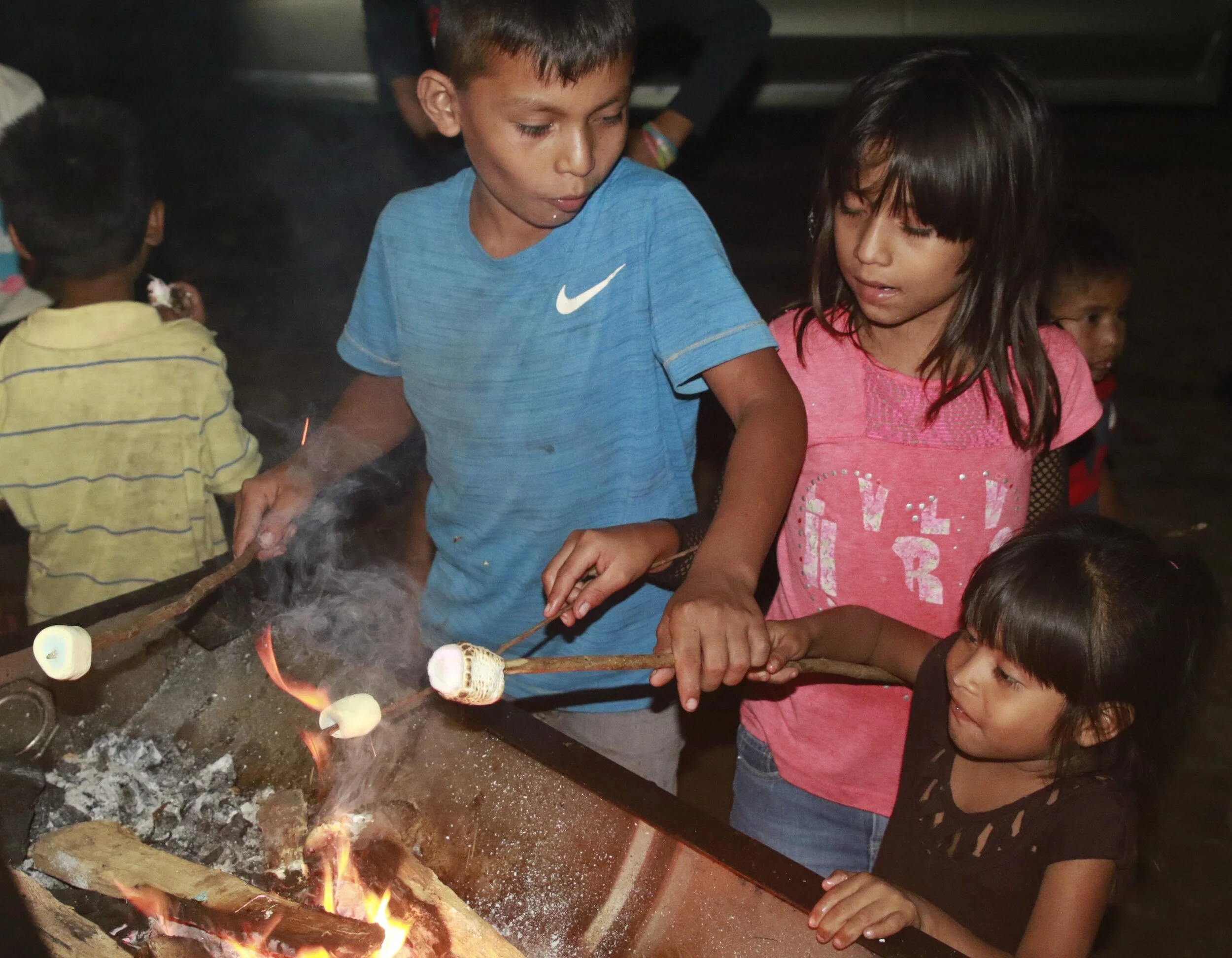 Having fun eating S'mores