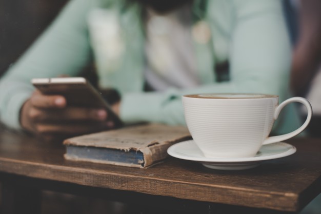 hipster-young-handsome-man-using-his-smartphone-while-sitting-at-bar-counter-at-cafe-background_1150-1478.jpg