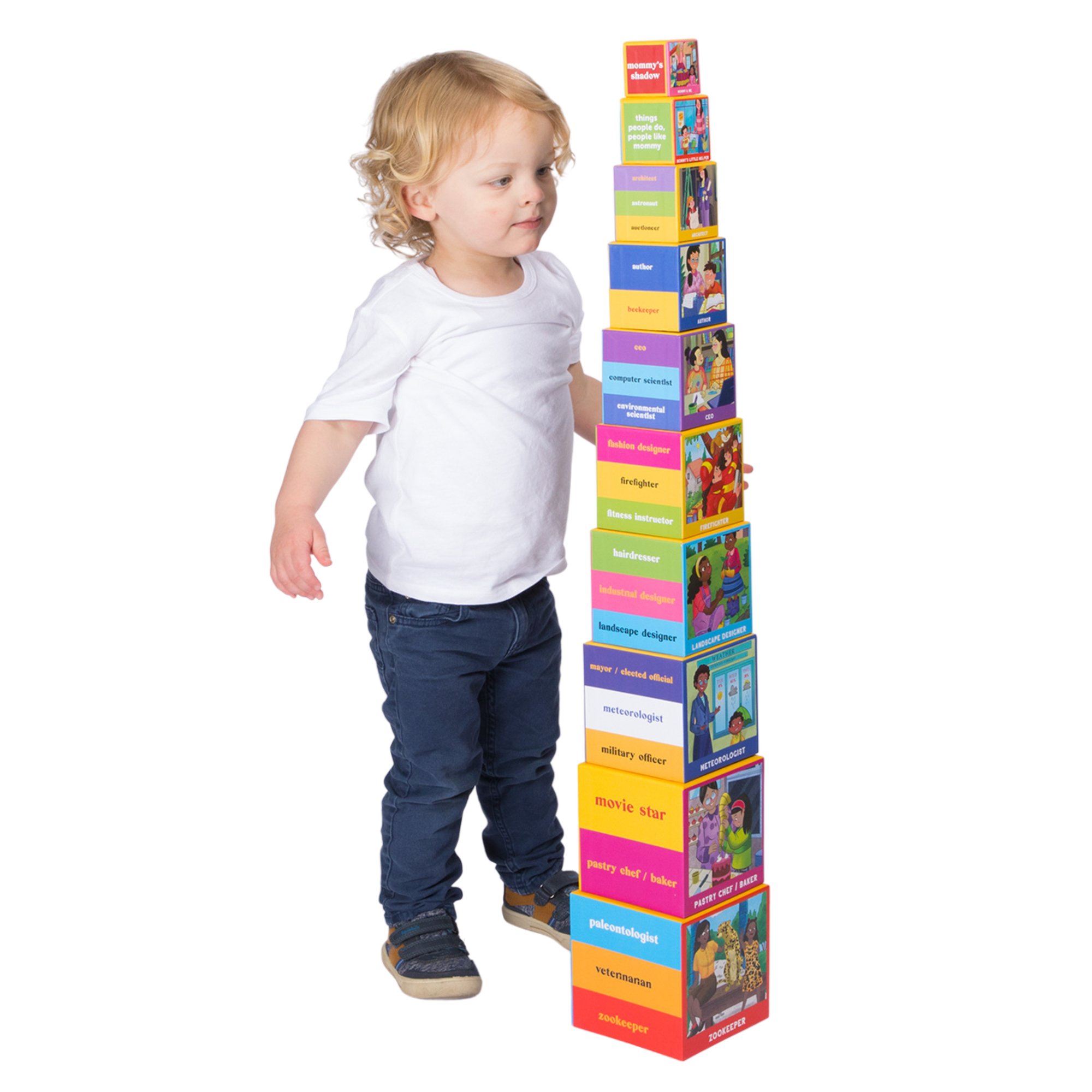 STKCUBE-MOM_LIFESTYLE IMAGE_tall building block tower w. toddler boy_white background_Upbounders Mom Careers Stacking Nesting Toy.jpg