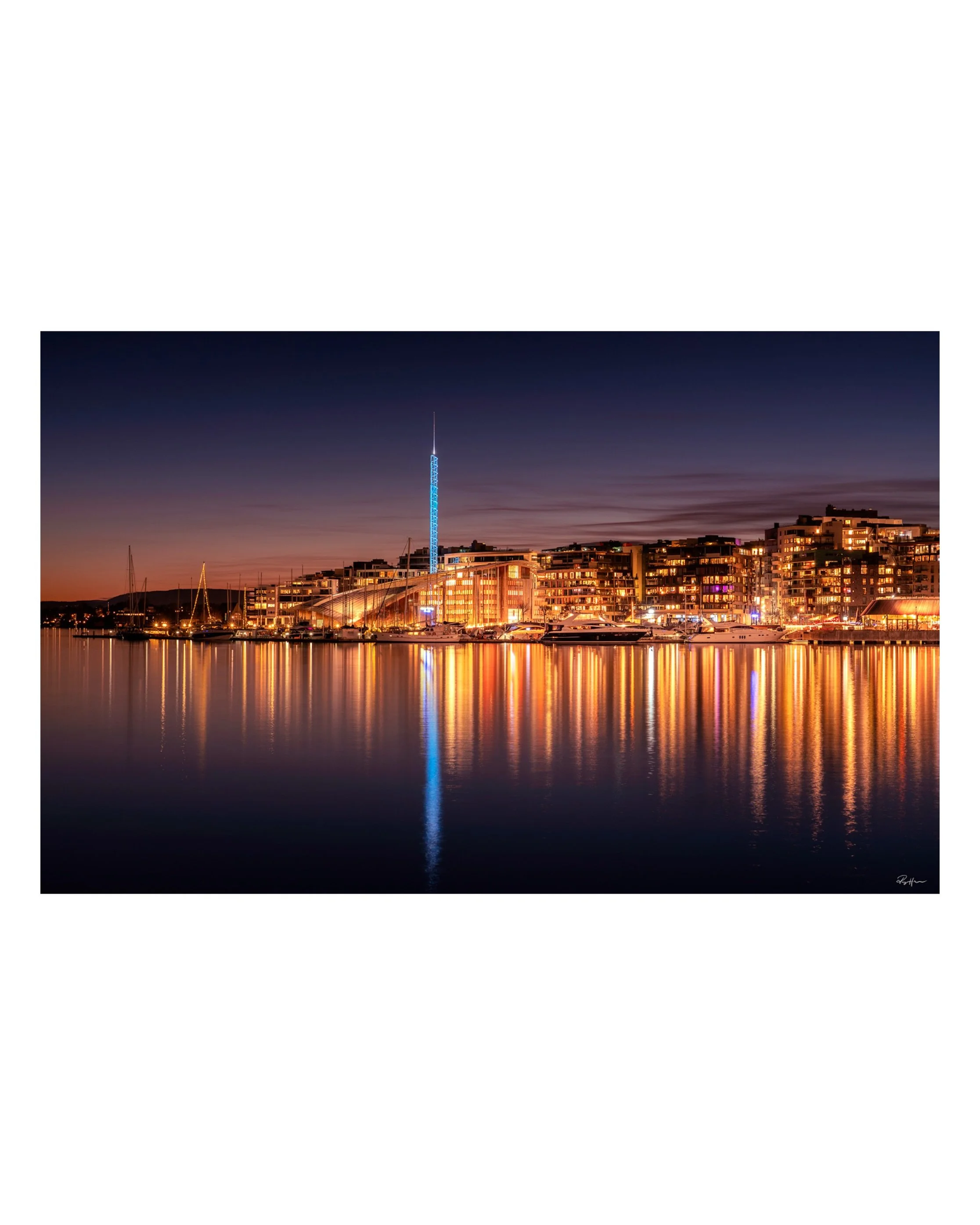 Some photographs are worth returning to.

I captured this view of Tjuvholmen and Aker Brygge in Oslo a few years ago, using a long exposure as evening settled over the city.

The longer shutter softened the water while the city lights stretched into 