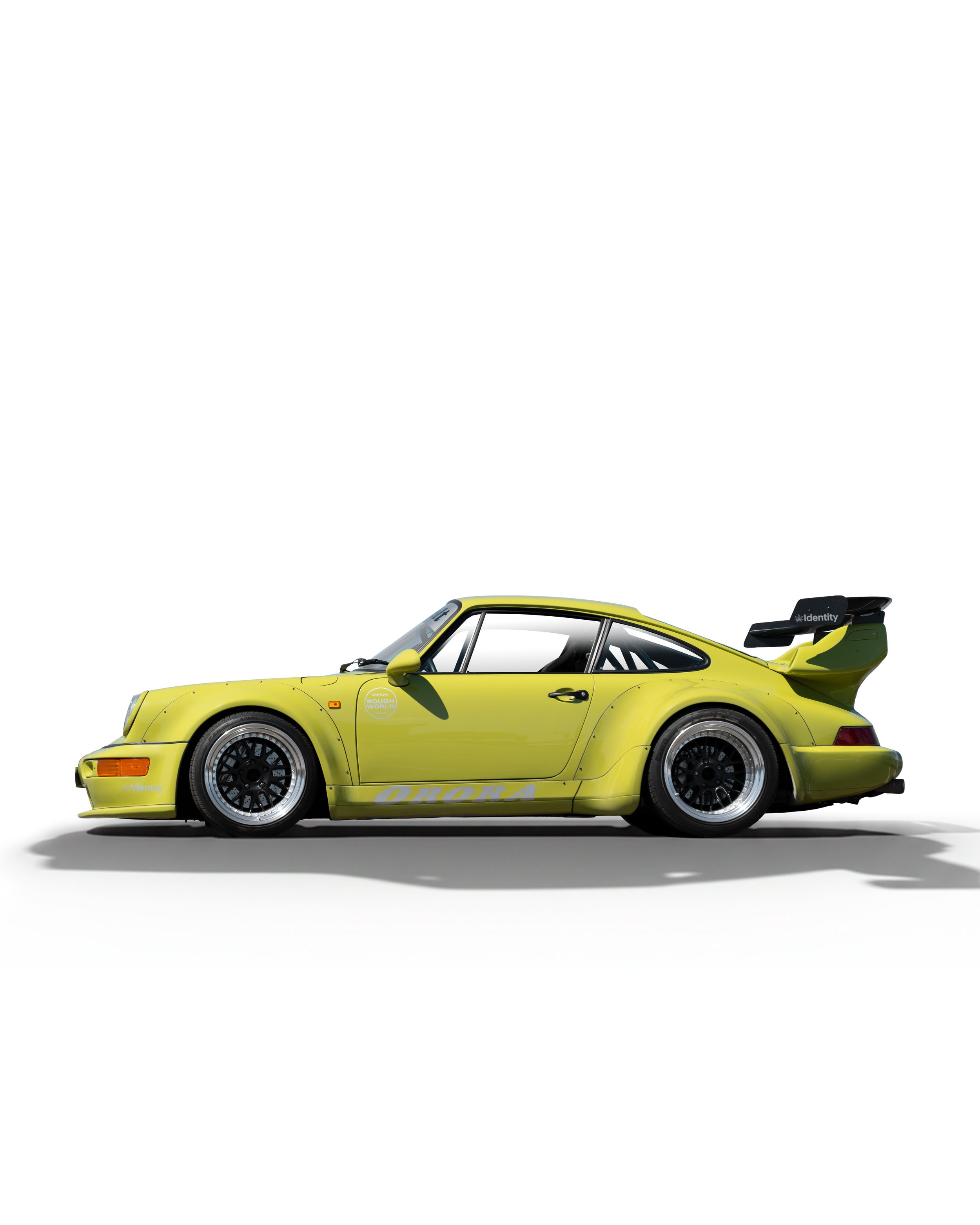 A bright yellow race car with black wheels and a spoiler, featuring decals and branding, isolated on a white background.