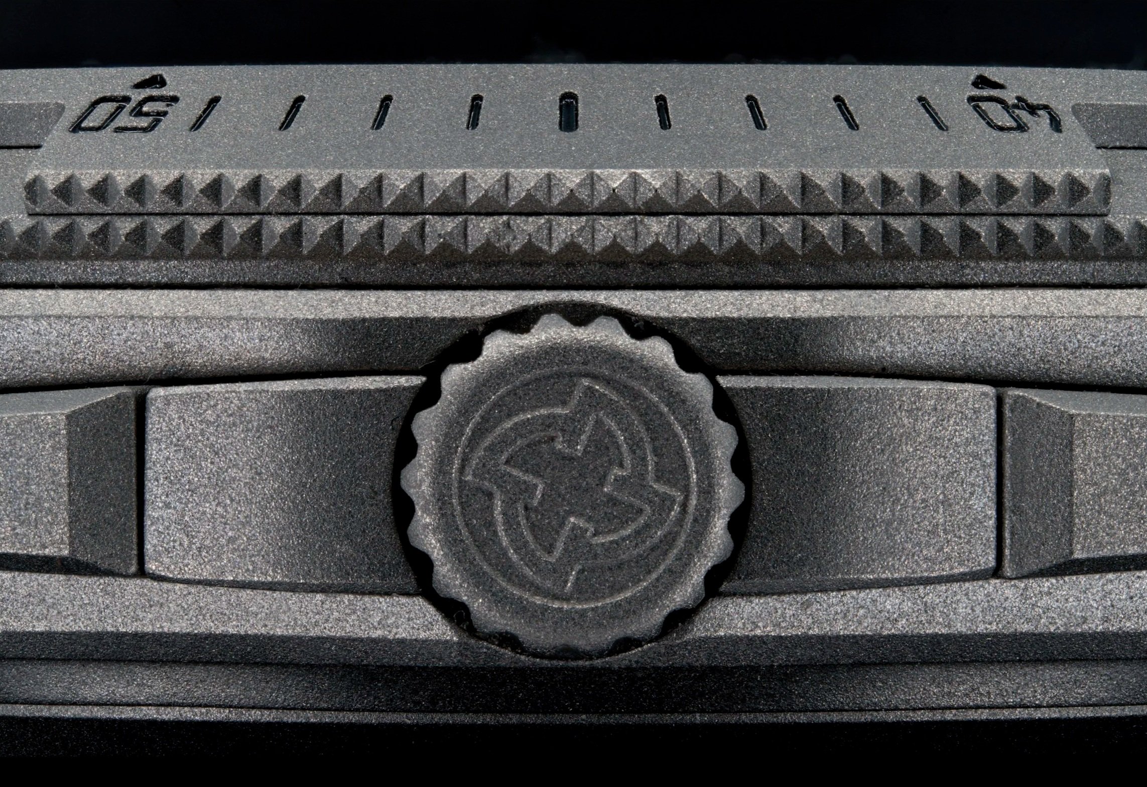 Detailed macrophoto of the crown on a Micromilspec Milgraph watch