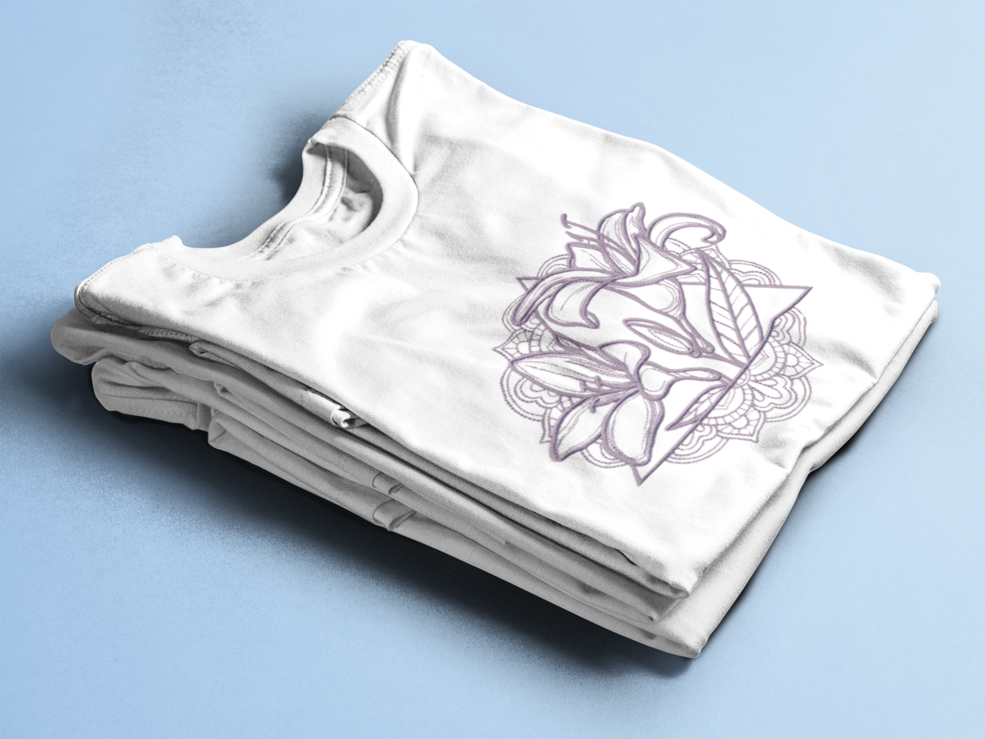 white lilly tee folded.png