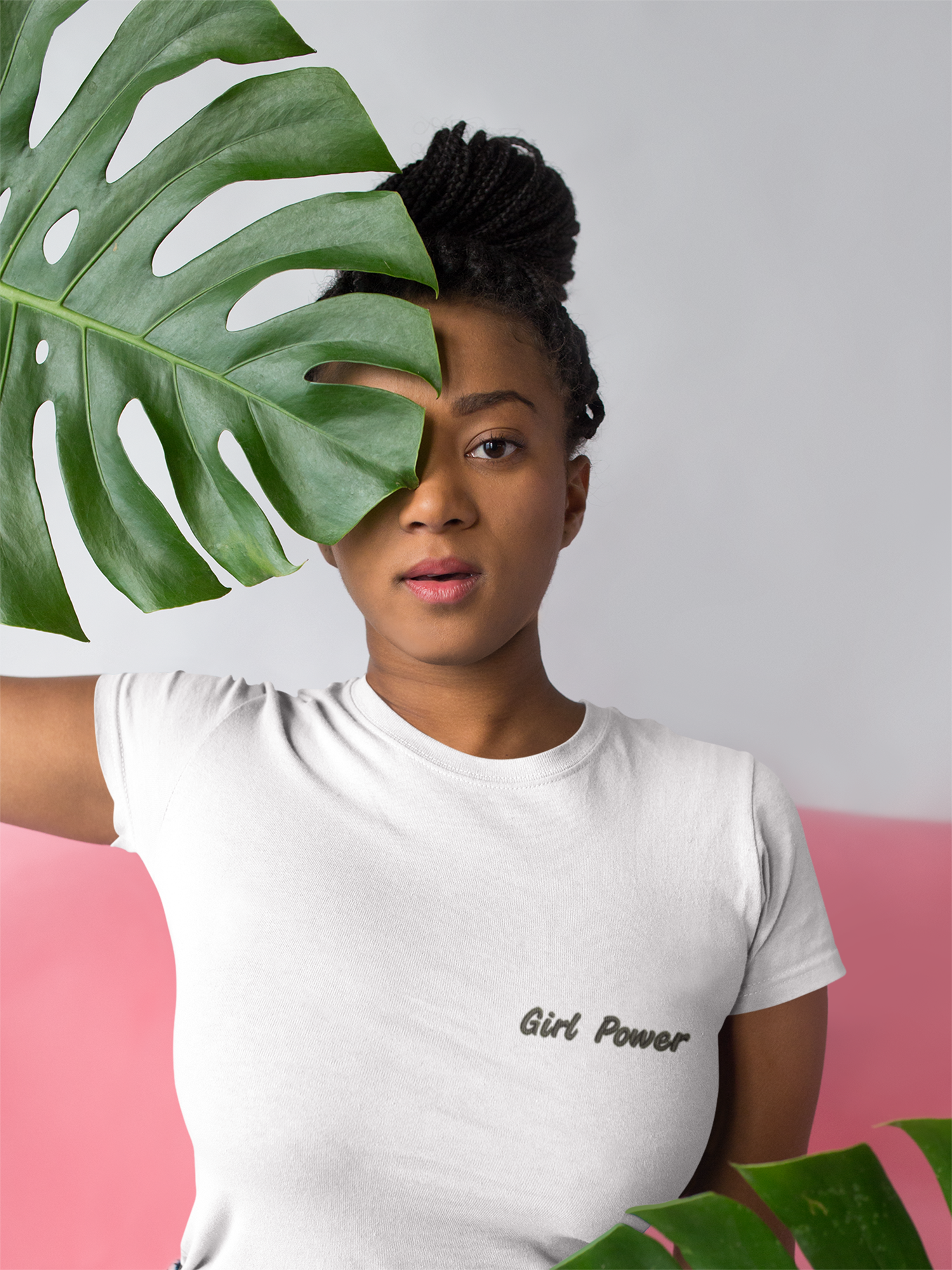 t-shirt-mockup-of-a-woman-holding-a-large-leaf-up-to-her-face-18368.png