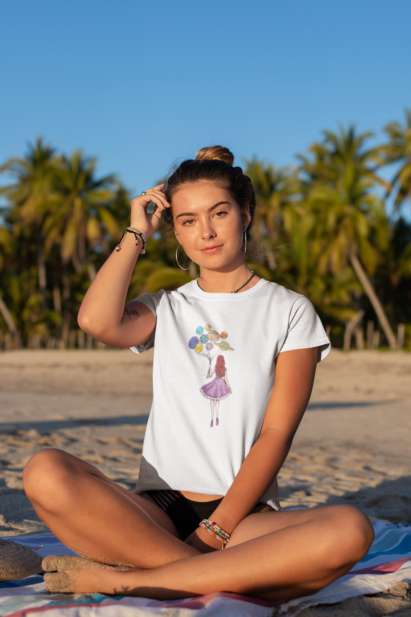 tee-mockup-of-a-bronzed-woman-sitting-by-palm-trees-at-the-beach-26802 (1).png