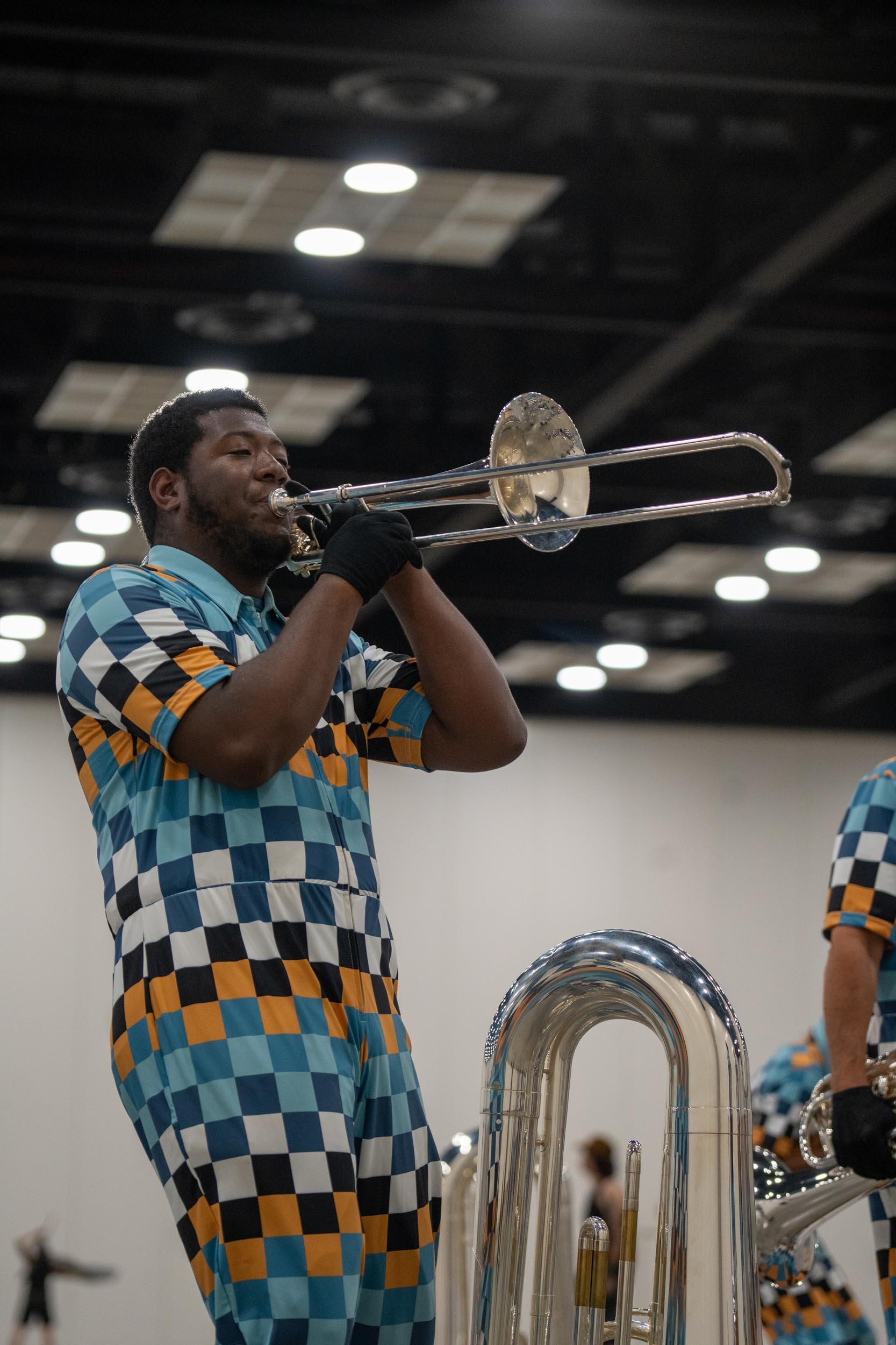 Action shot of Rhythm IN BLUE trombone player.