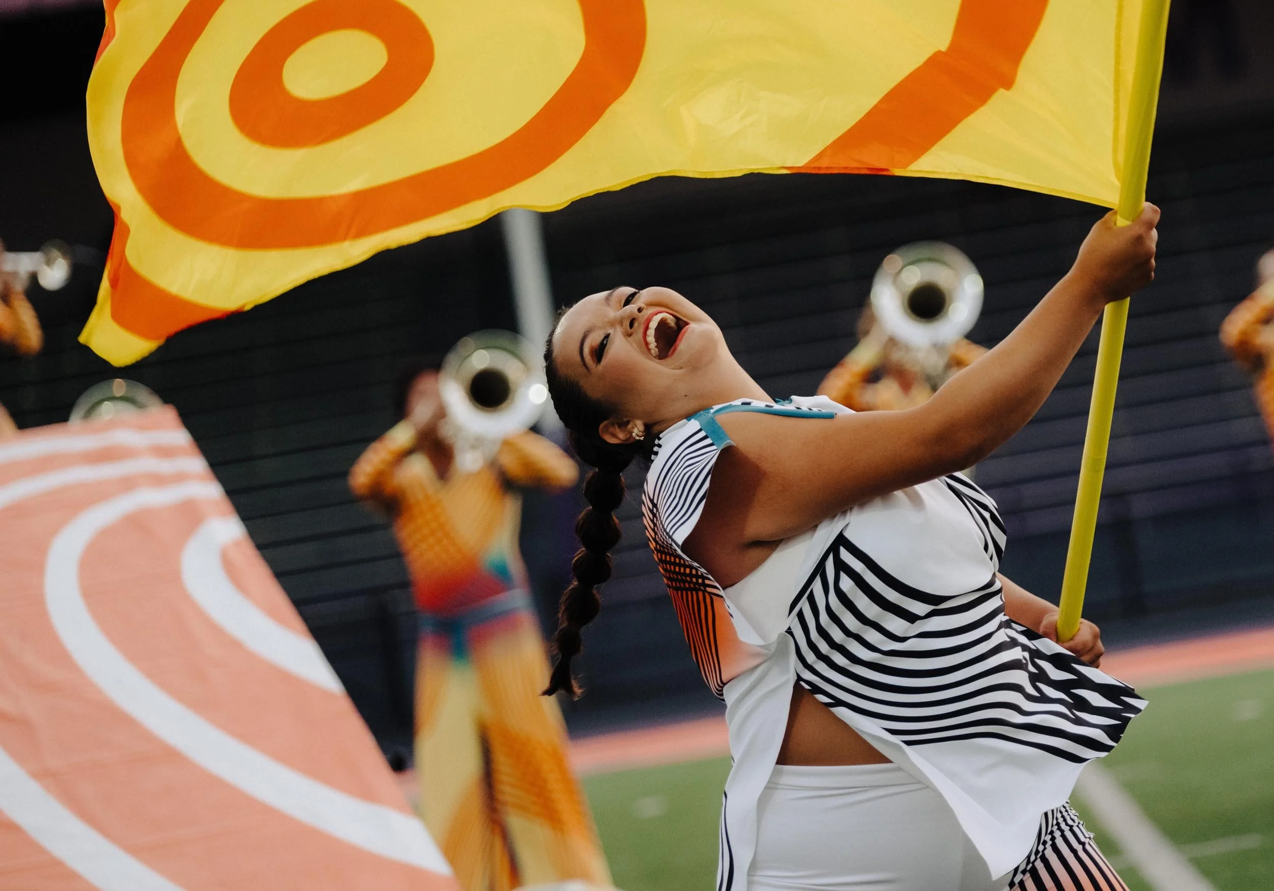 Bluecoats color guard performer spinning flag.