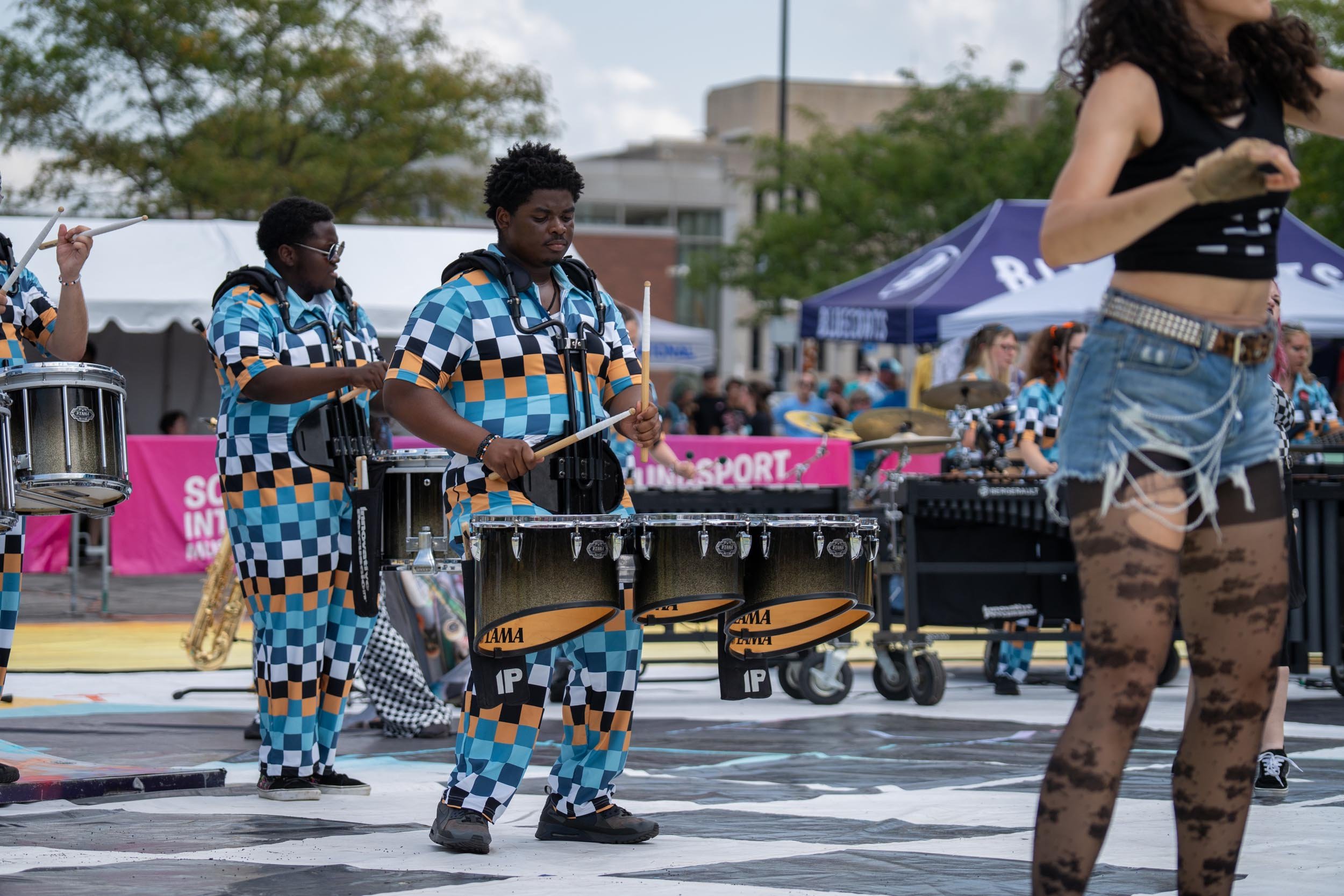 Action shot of Rhythm IN BLUE drummers.