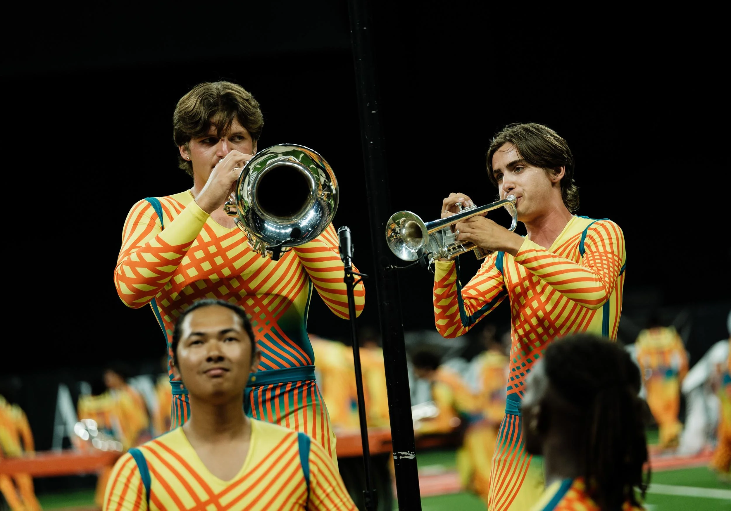 Action shot of two brass players.