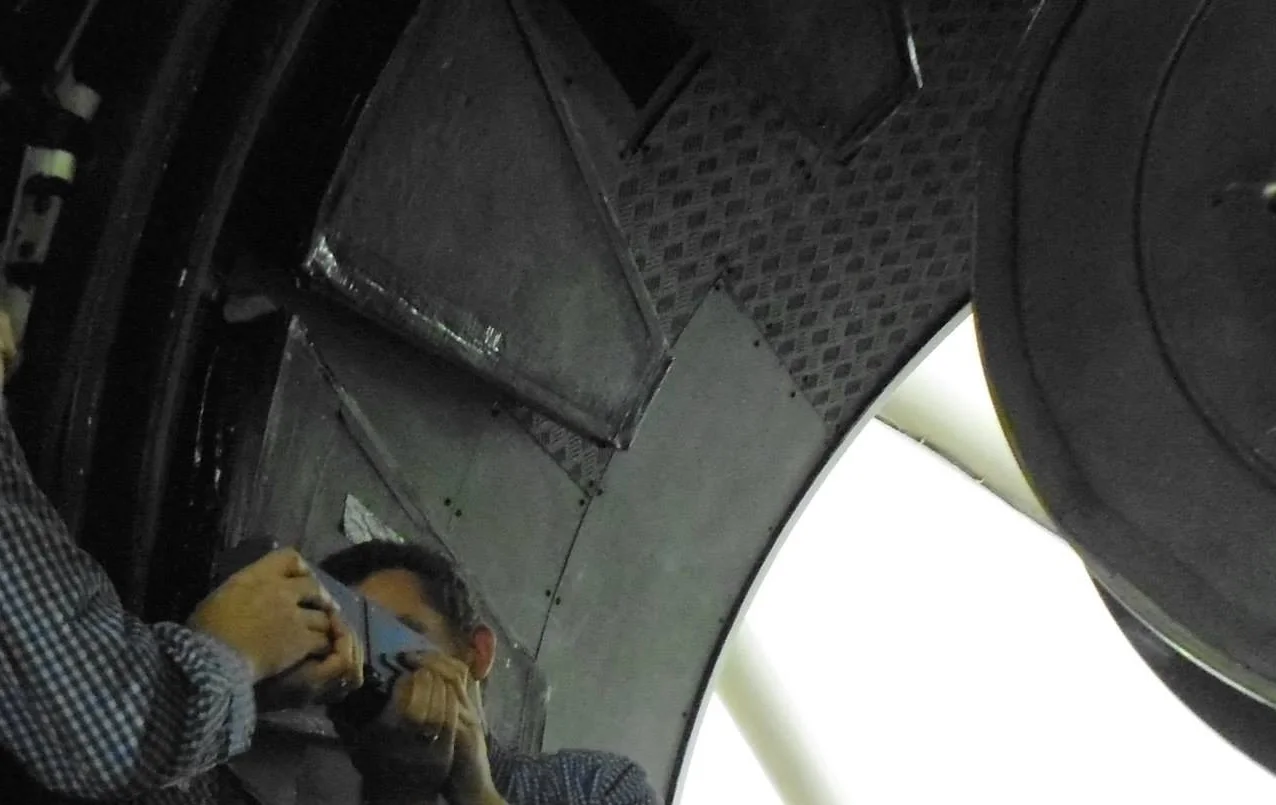 Primary mirror after cleaning. You can see our boss testing refelctivity.