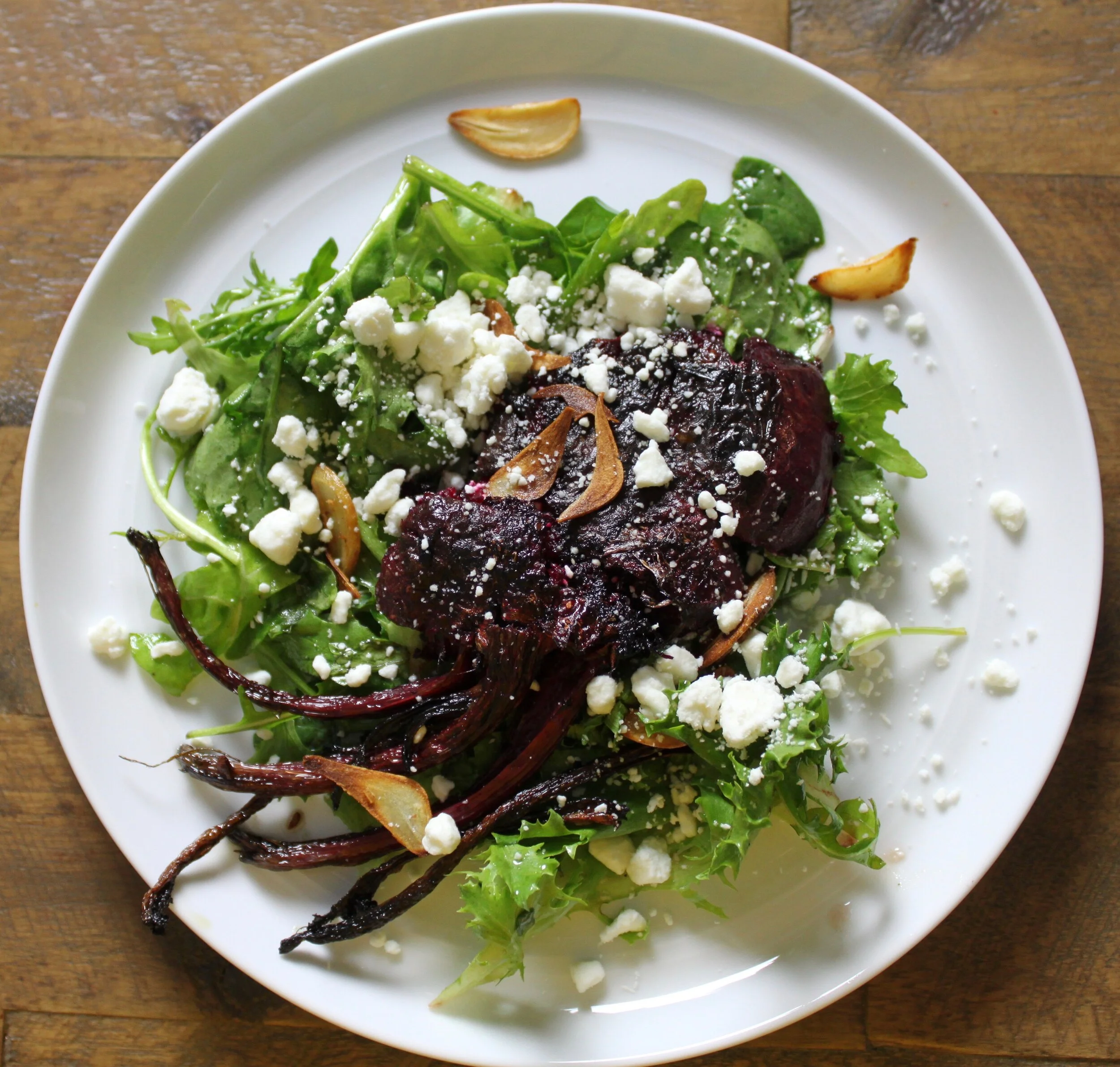 Smashed Beets with Greens, Goat Cheese and Garlic Chips 