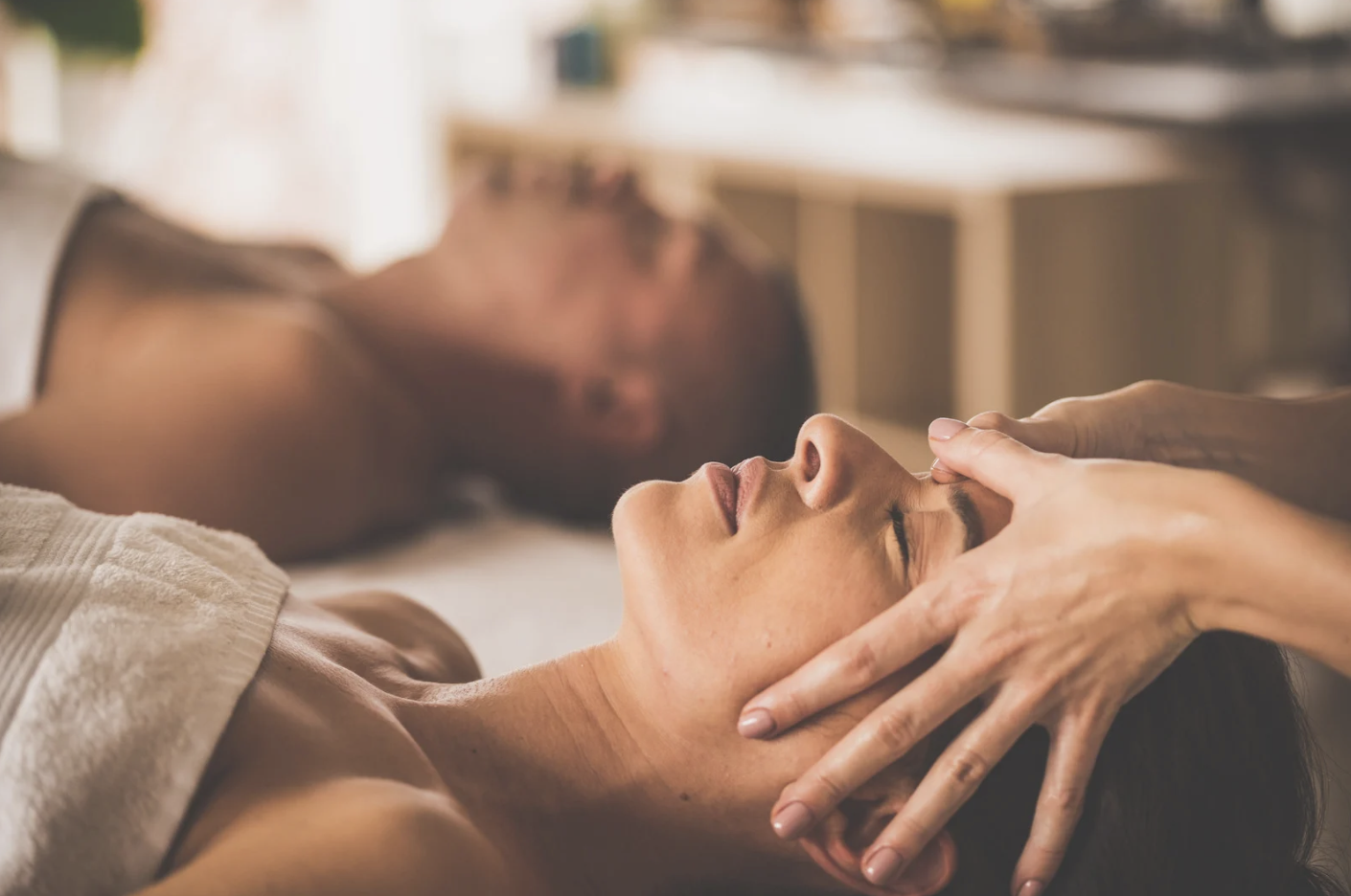 Couple receiving luxury facial treatments at Skin RNI wellness clinic in Canmore, perfect for group spa bookings or pre-wedding relaxation.