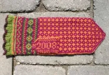 ladies knitted Amaryllis mittens with date on thumbs