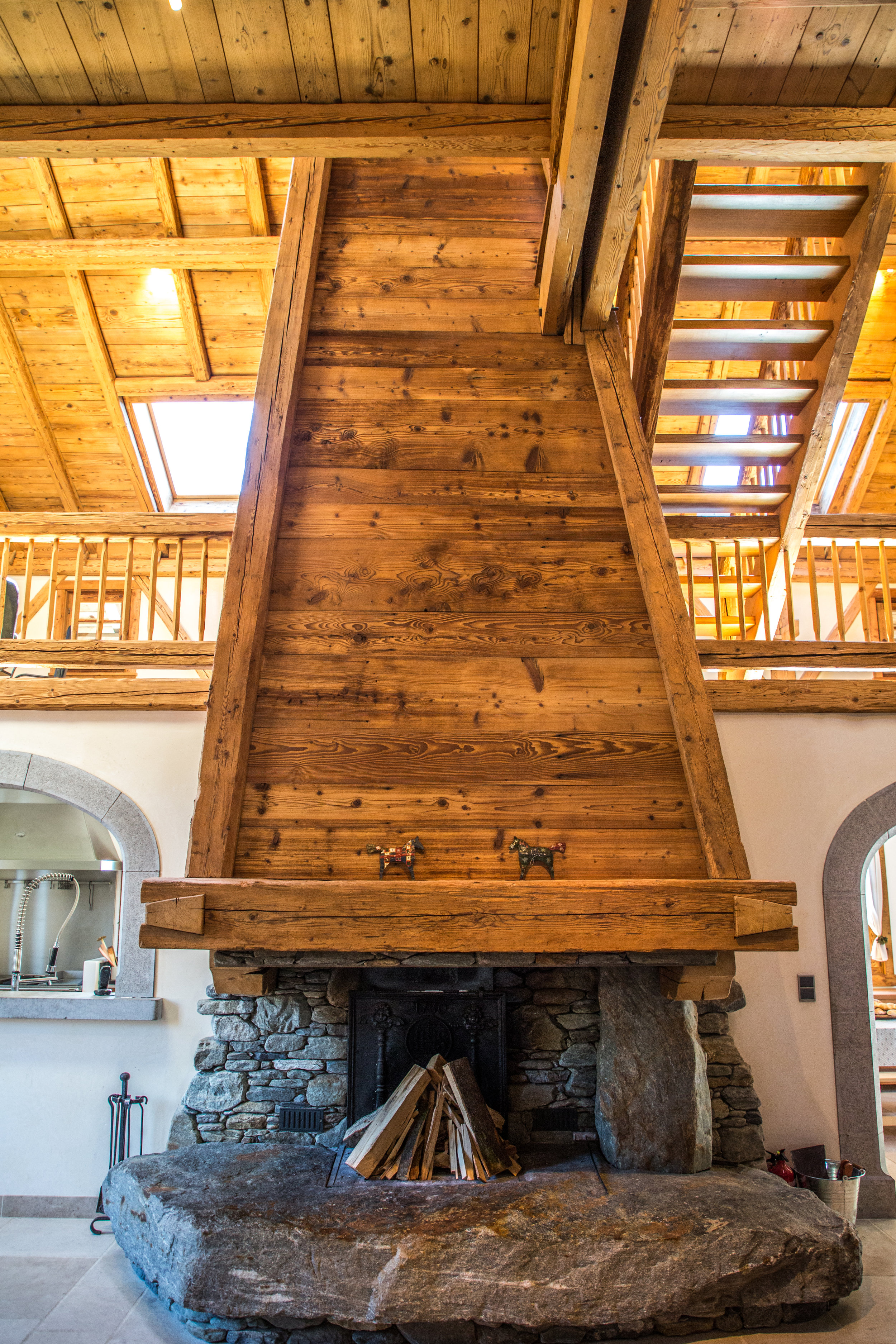 Huge stone fireplace and old wood chimney in Living Room at Chalet Forest 