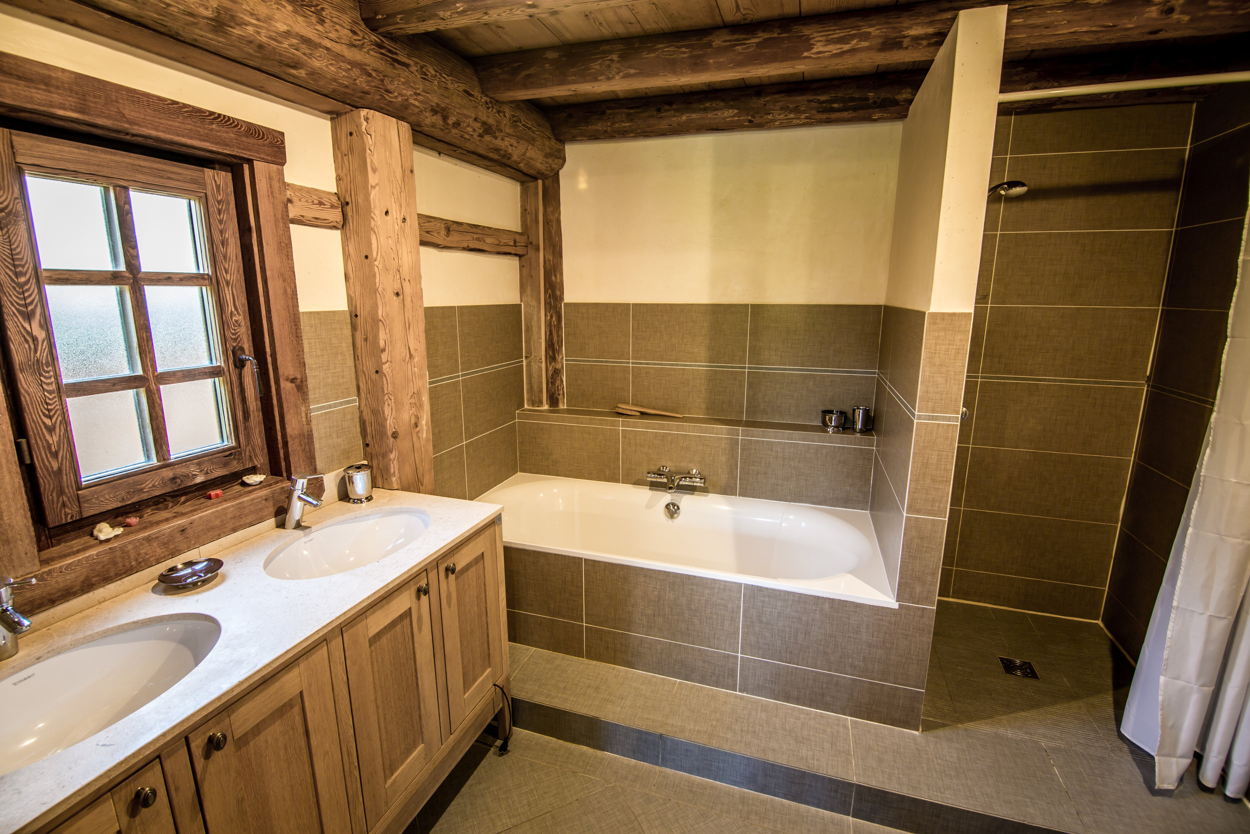 Bedroom #2 's ensuite bathroom w/ double sink, large bath and separate shower