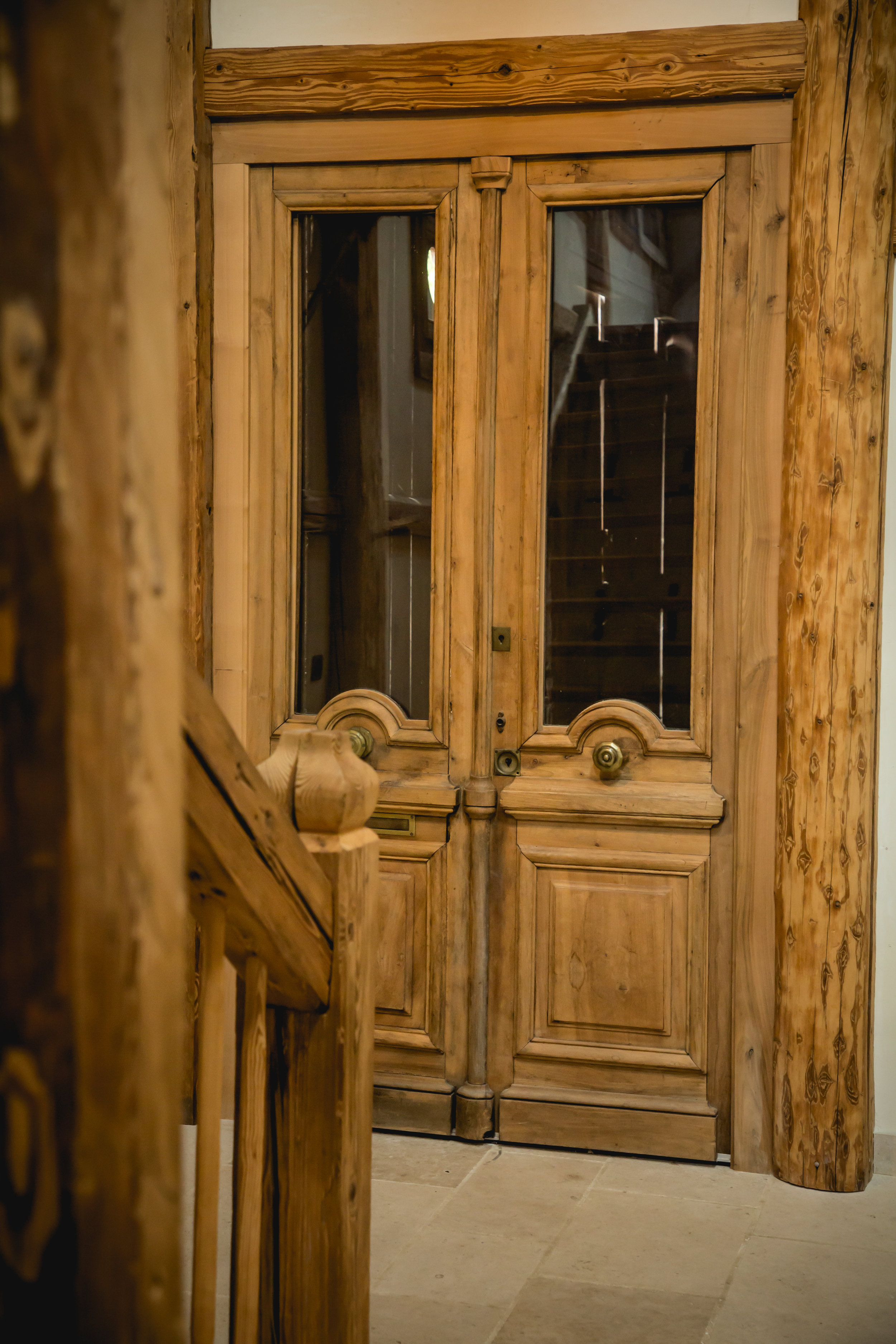 Beautiful Reclaimed old wood doors used in living room at Chalet Forest