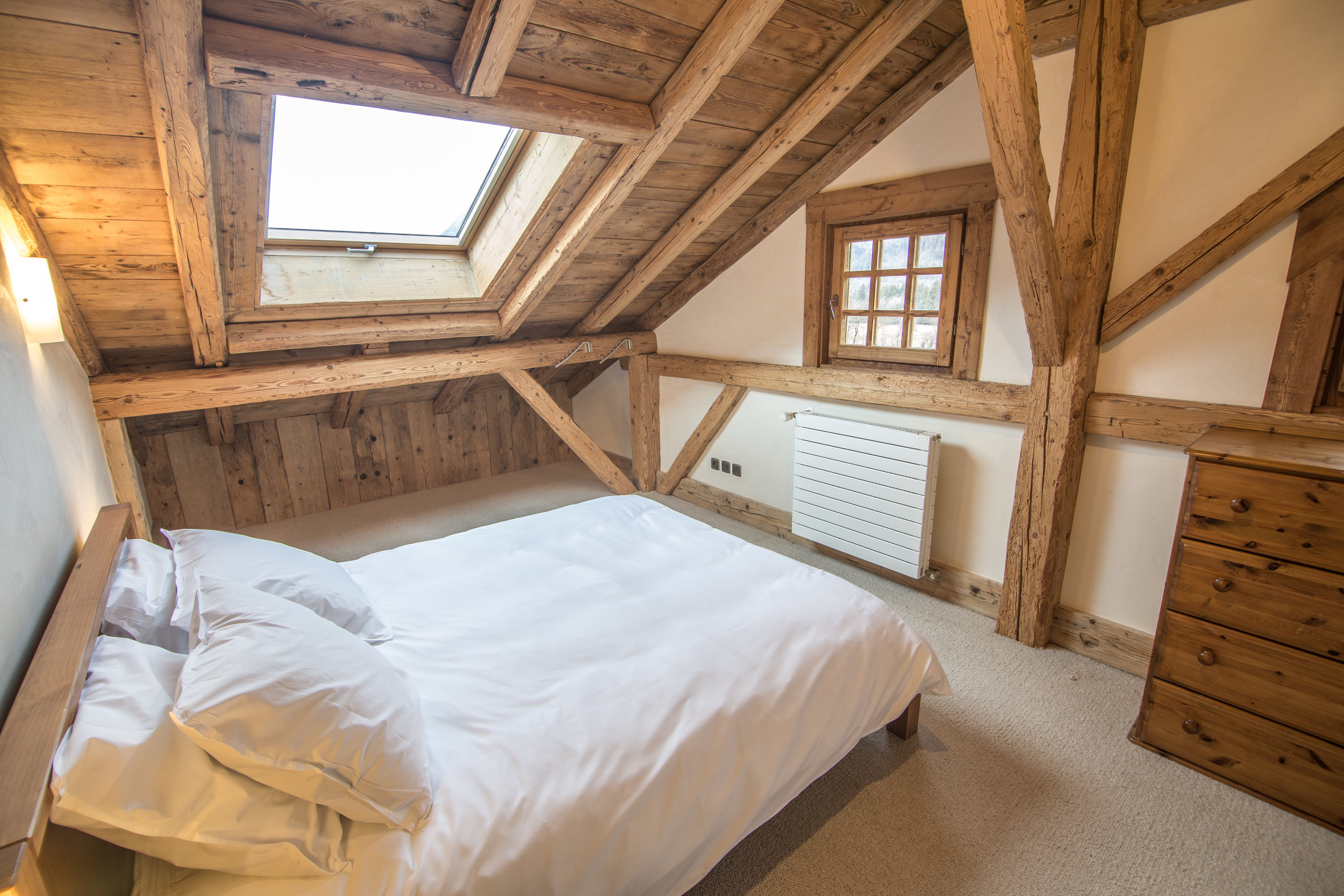 Bedroom #4 with Queen bed and skylight, wool carpet